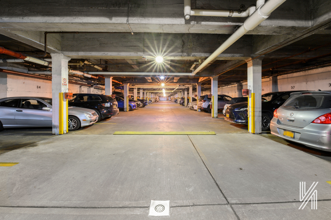 34-41 85th Street, Unit 1U Queens, NY 11372 - Photo 23 of 24 a view of parking garage with cars