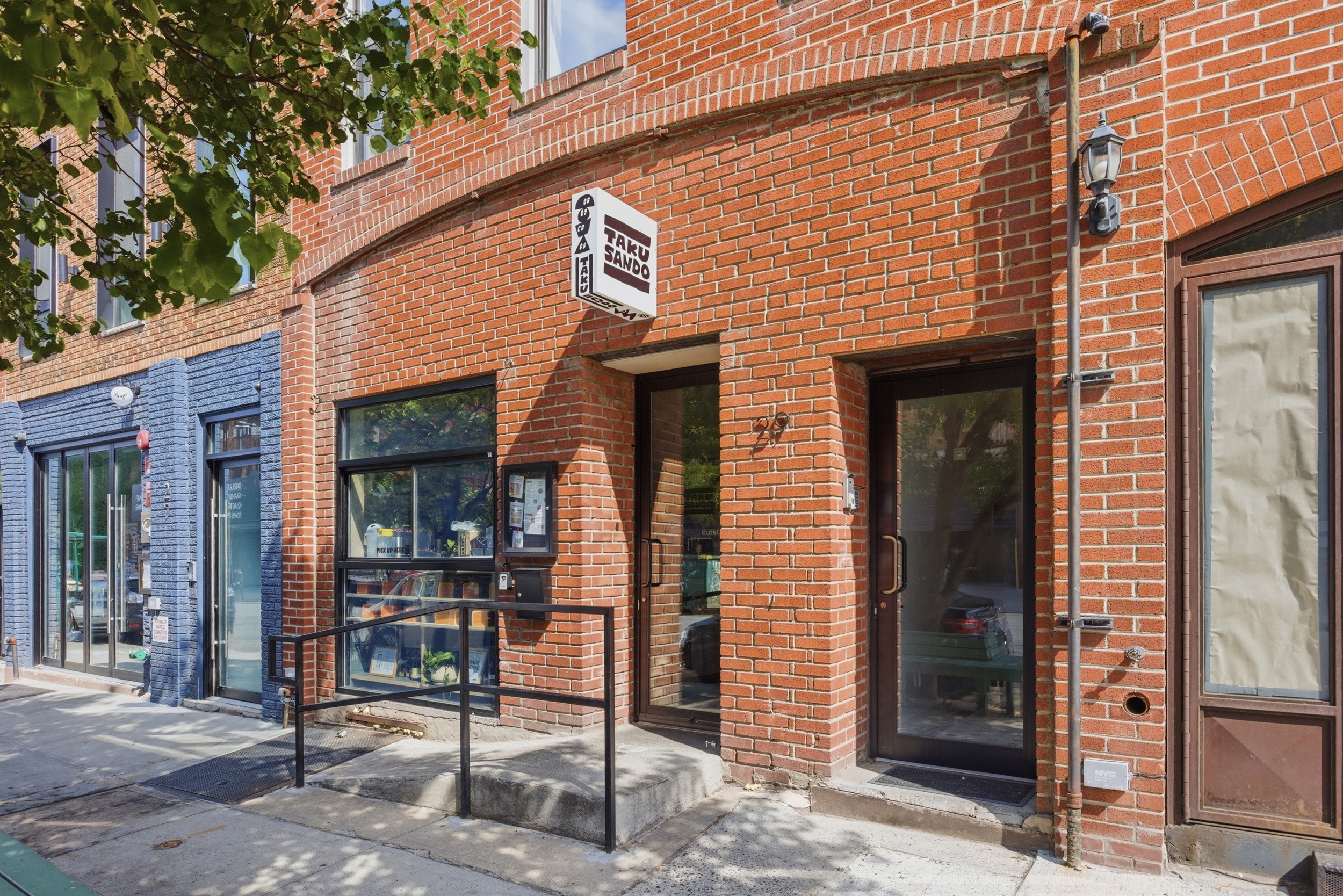 29 Greenpoint Avenue Brooklyn, NY 11222 - Photo 3 of 18 a front view of a house with glass windows
