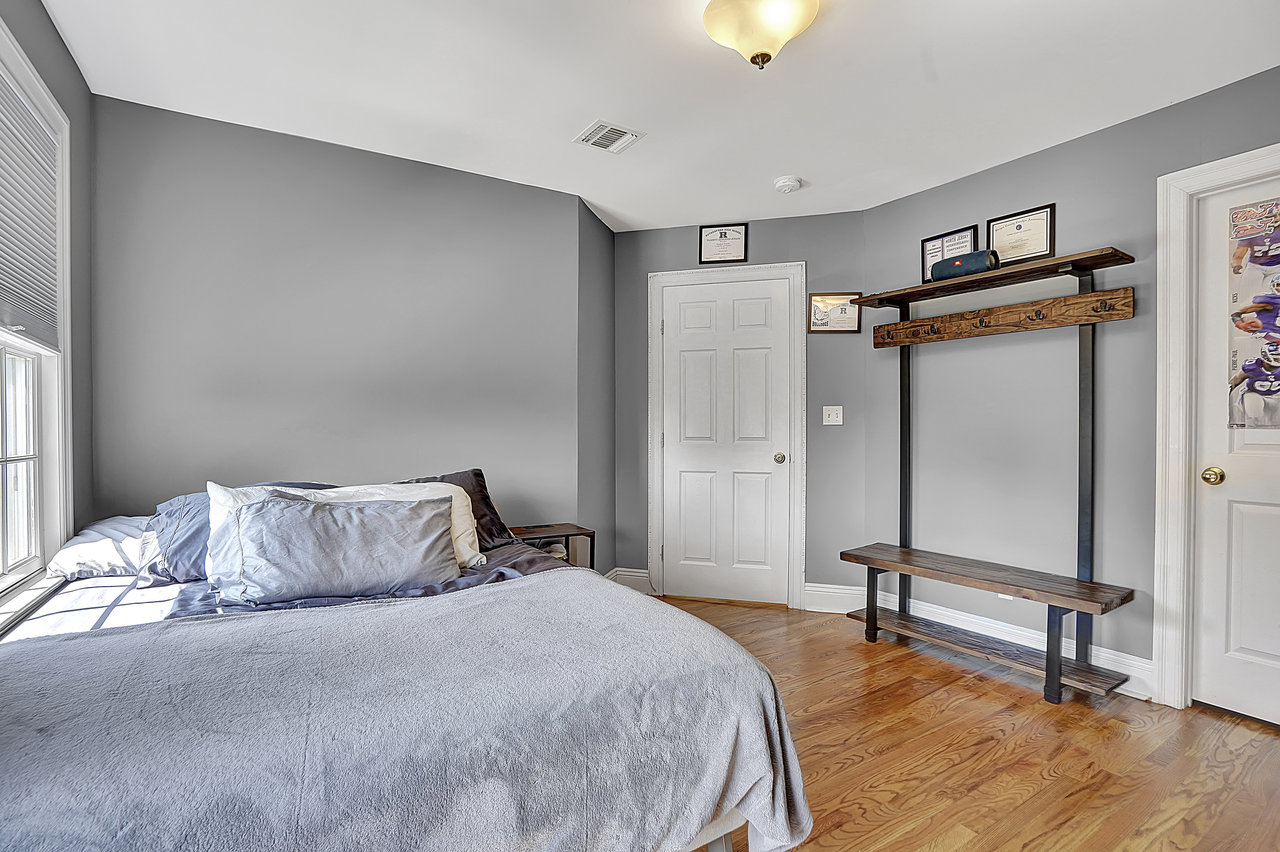 266 Feronia Way Rutherford, NJ 07070 - Photo 27 of 41 a bedroom with a bed and a dresser