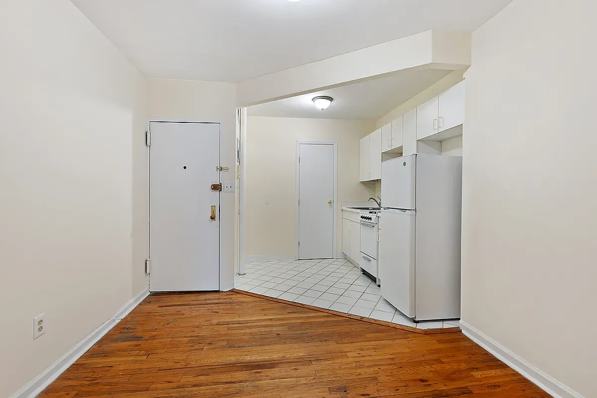 107 East 2nd Street, Unit 11 Manhattan, NY 10009 - Photo 2 of 7 a view of a big room with wooden floor and a bathroom