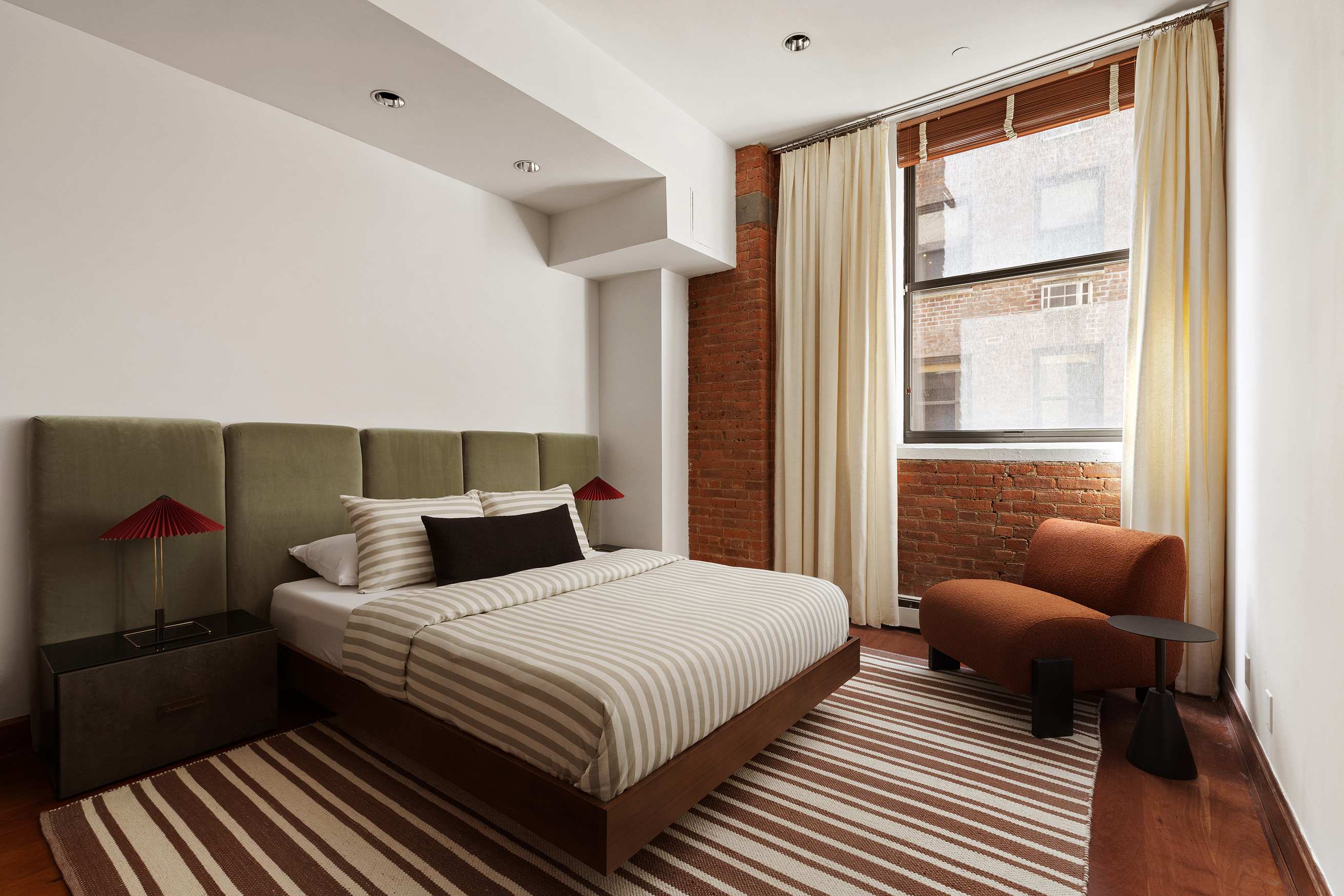 40 West 13th Street, Unit 2 Manhattan, NY 10011 - Photo 12 of 14 a bedroom with bed couch and window