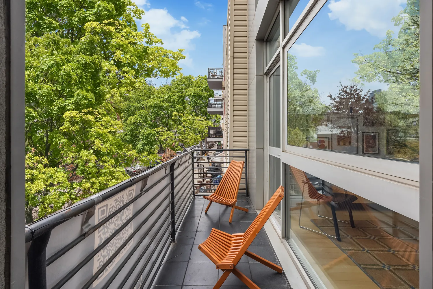 a view of balcony with wooden floor and bench