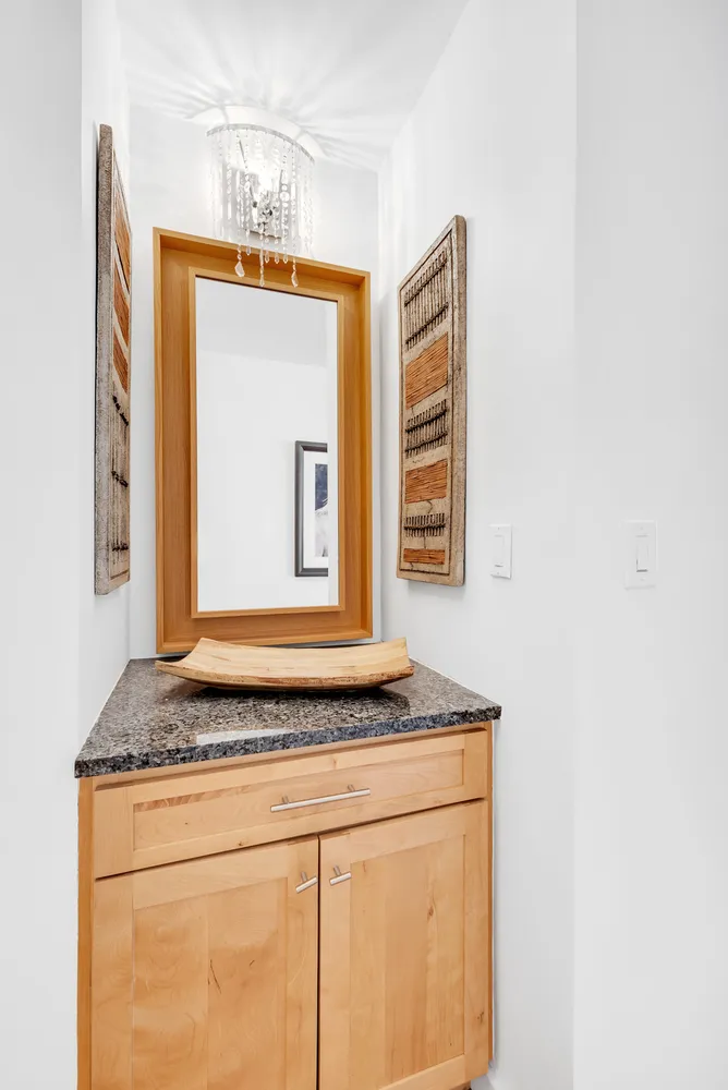 a view of kitchen cabinets a sink and a window