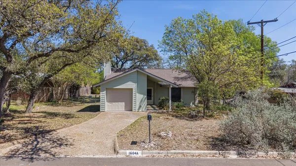 a house with trees in the background