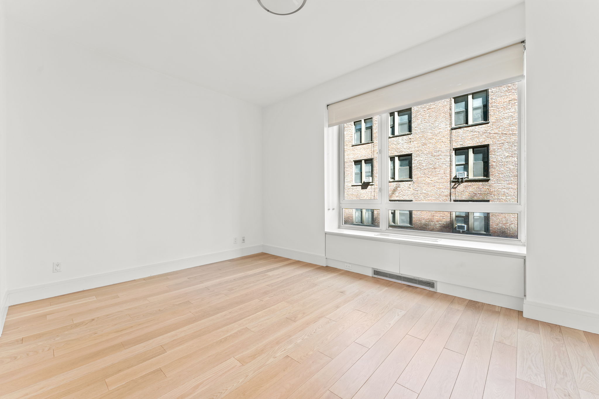 545 West 110th Street, Unit 5A Manhattan, NY 10025 - Photo 17 of 20 a view of an empty room with a window