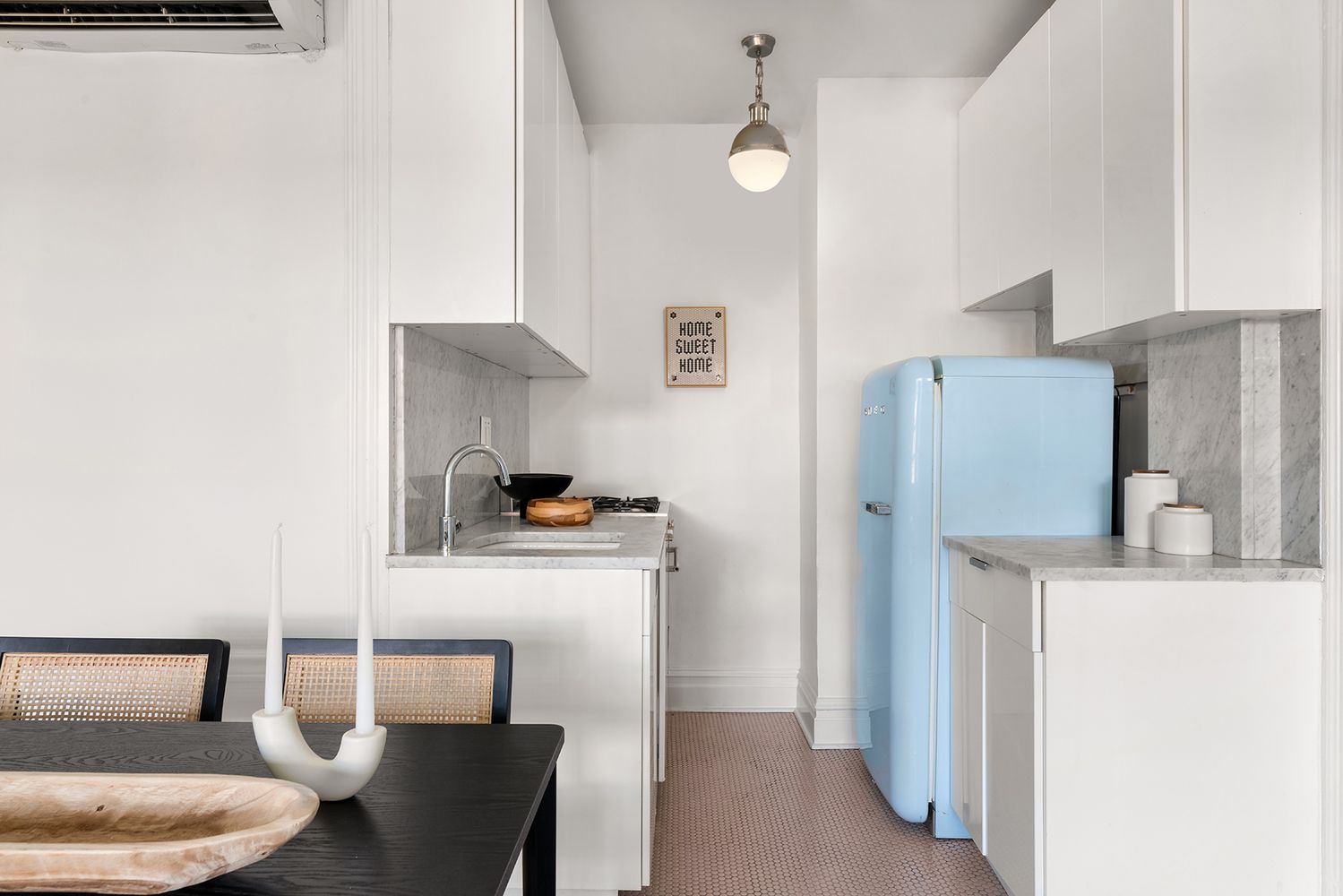 30-32 West 9th Street, Unit 5A Manhattan, NY 10011 - Photo 10 of 18 a kitchen with stainless steel appliances a refrigerator and a stove