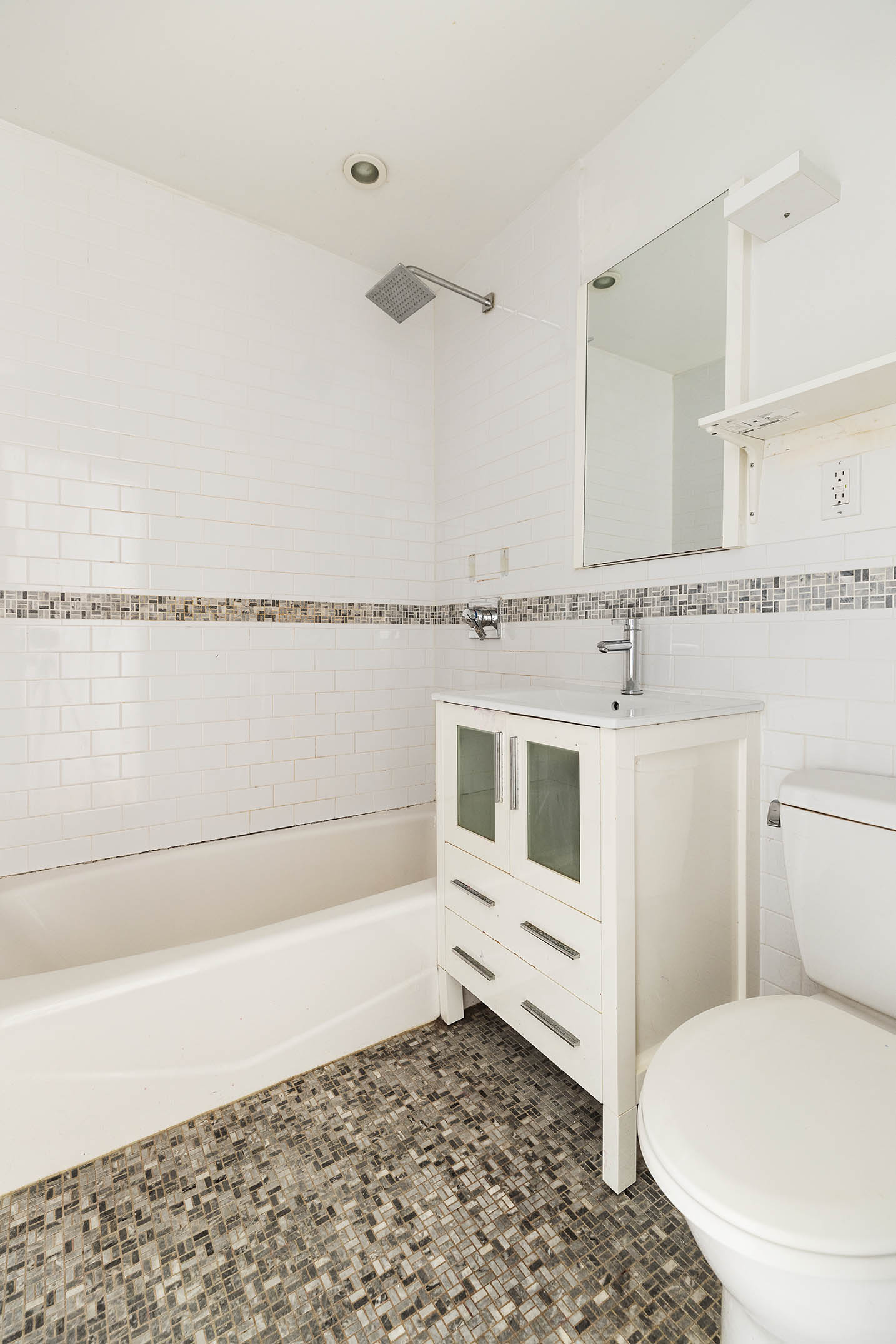 2116 Dorchester Road, Unit 1I Brooklyn, NY 11226 - Photo 10 of 15 a bathroom with a toilet a sink and a bathtub