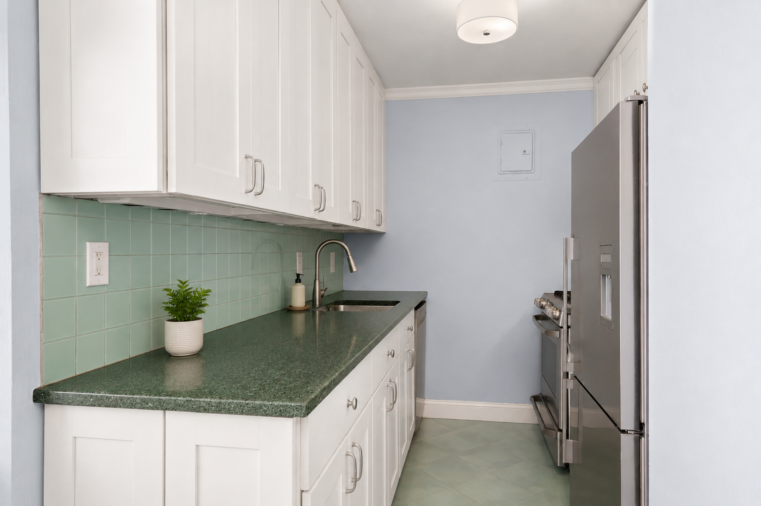 201 East 21st Street, Unit 2FG Manhattan, NY 10010 - Photo 4 of 10 a kitchen with a sink and dishwasher