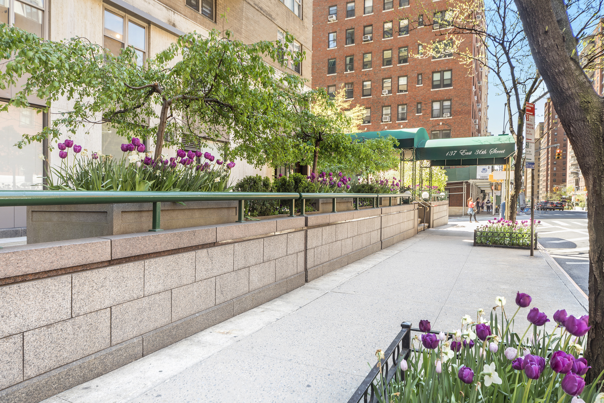 137 East 36th Street, Unit 7H Manhattan, NY 10016 - Photo 6 of 11 a view of a street with a building in the background