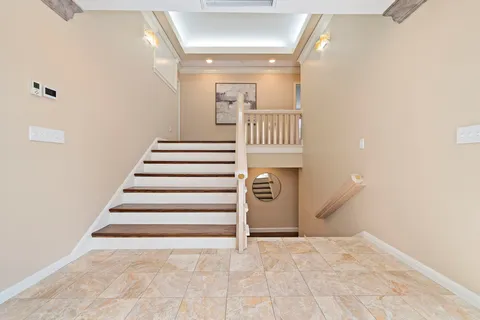 a bathroom with a double vanity sink a large mirror and a shower