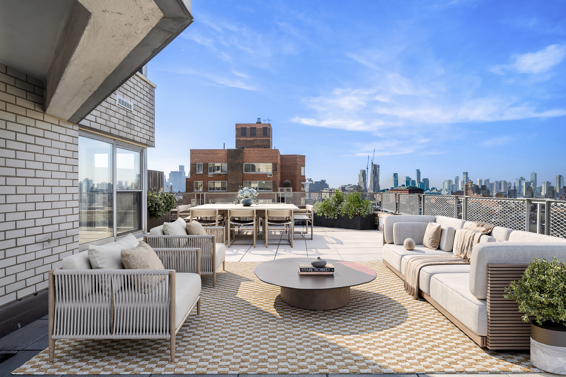 a view of a roof deck with couches and potted plants