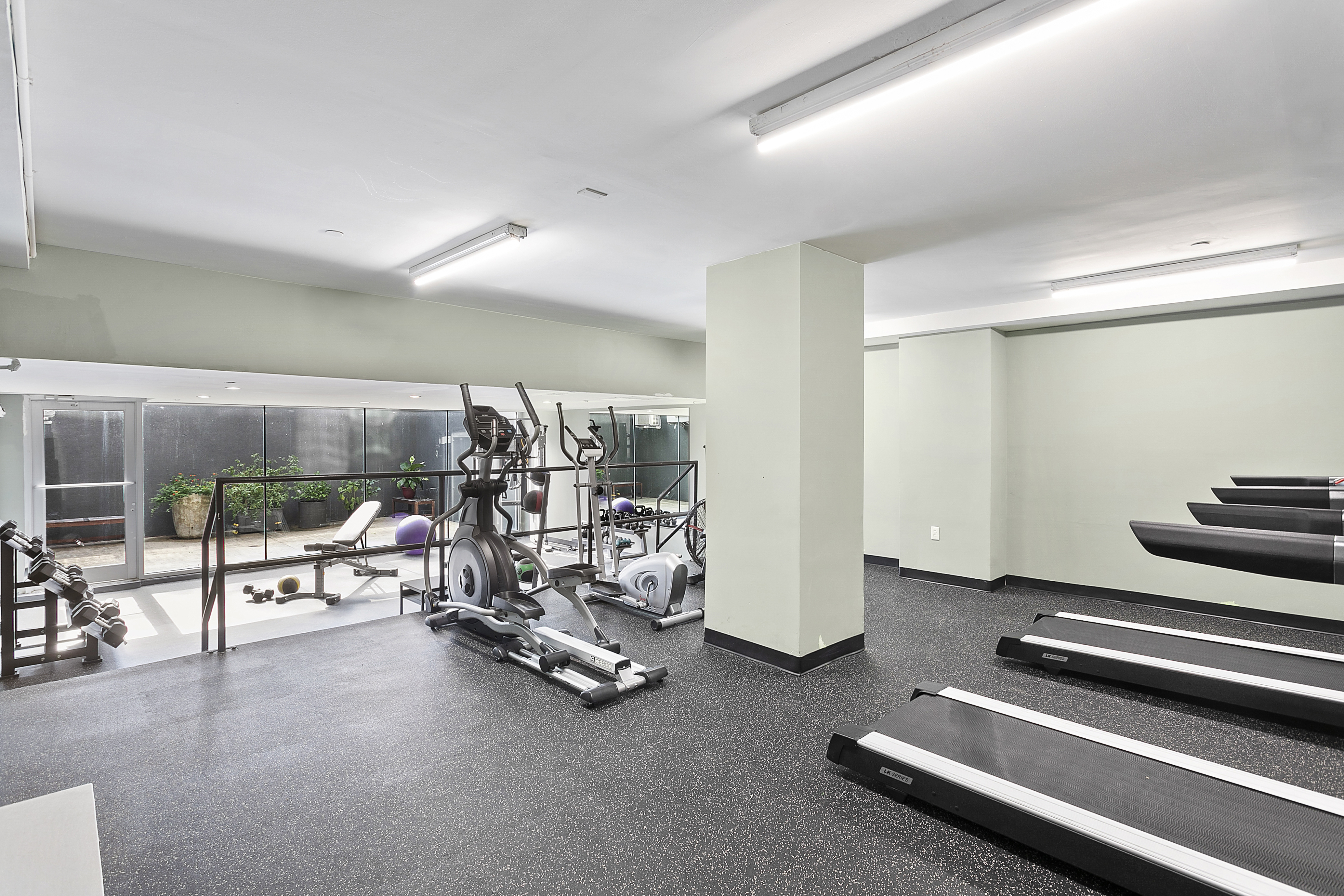 480 Humboldt Street, Unit 3B Brooklyn, NY 11211 - Photo 6 of 17 a view of a room with gym equipment