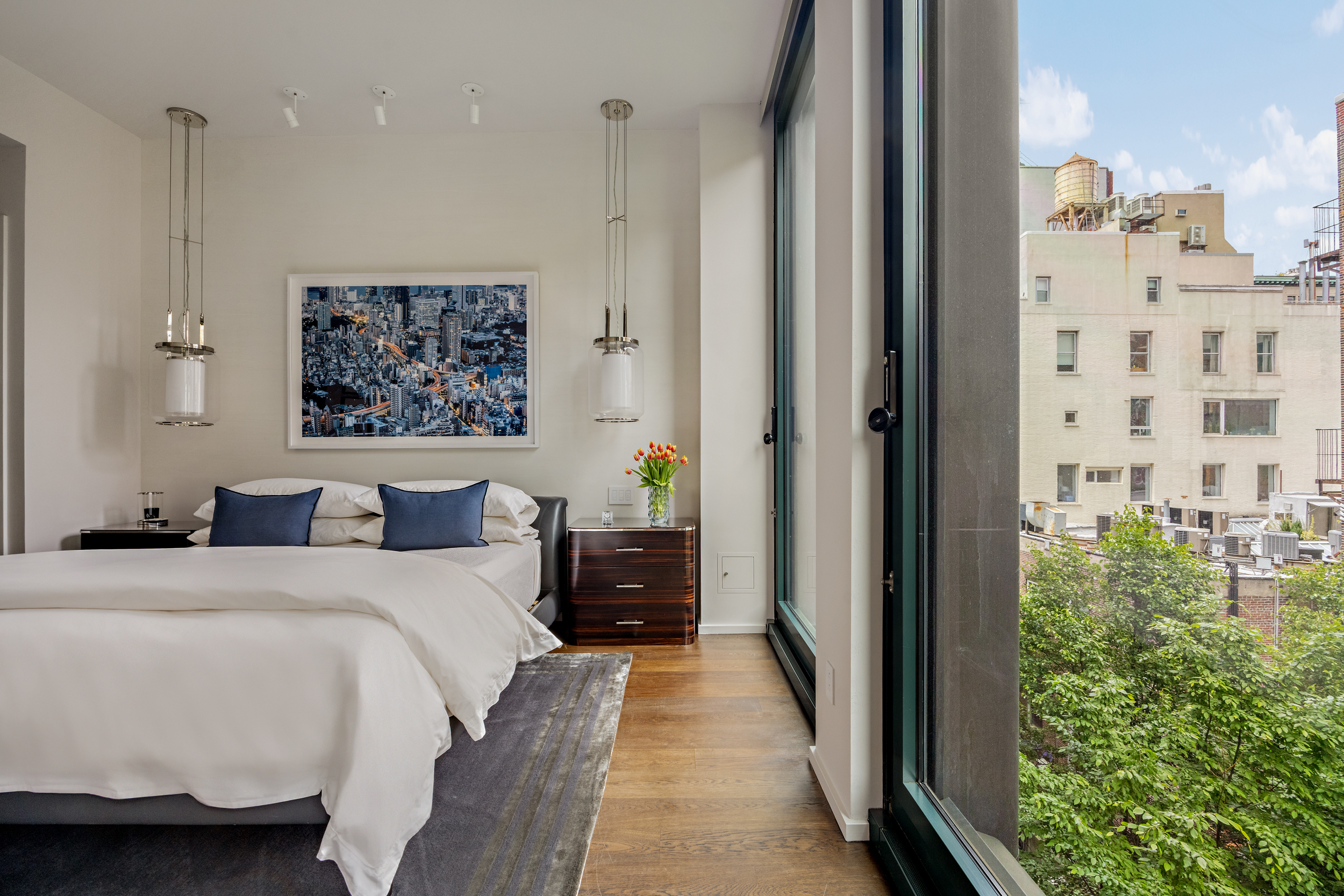 40 Bond Street, Unit 6D Manhattan, NY 10012 - Photo 13 of 23 a bedroom with a bed and a painting on the wall