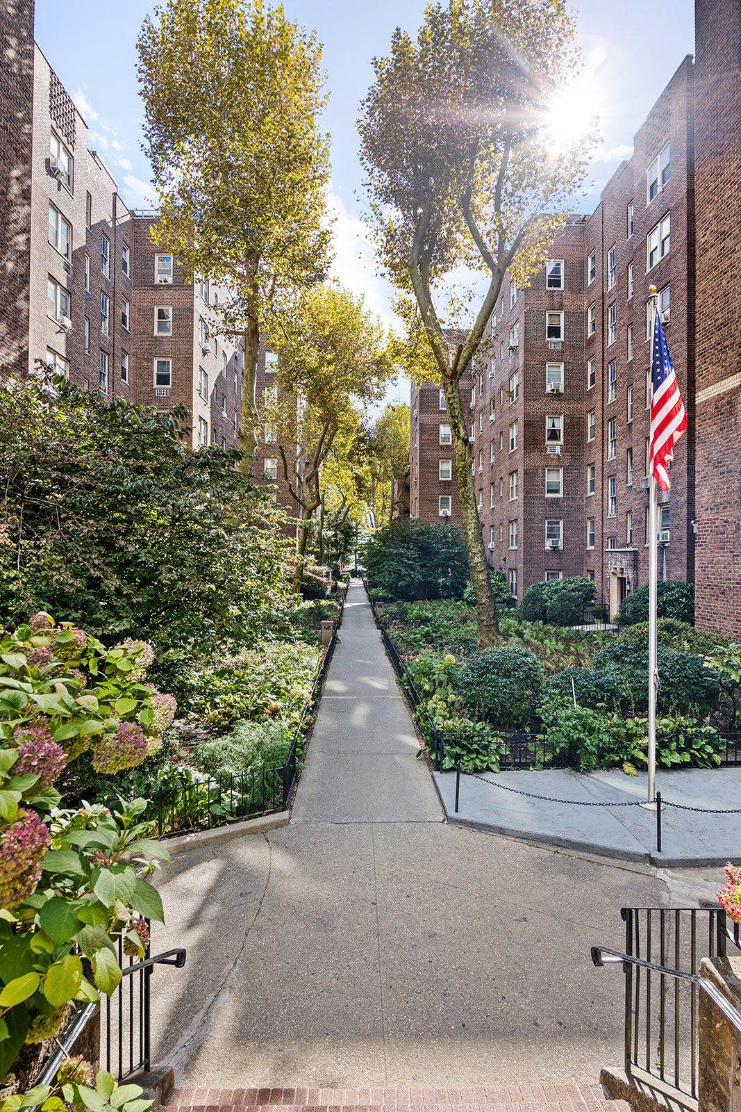 48-19 43rd Street, Unit 4A Queens, NY 11377 - Photo 6 of 8 a view of a building with a yard