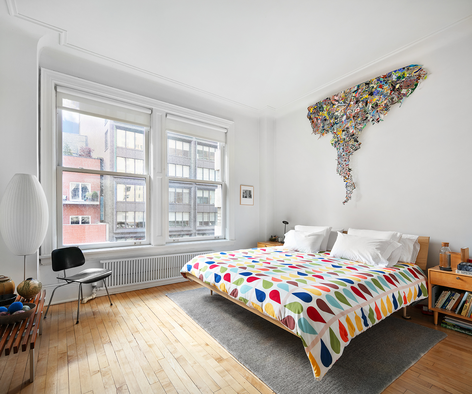 366 Broadway, Unit 8A Manhattan, NY 10013 - Photo 7 of 13 a bedroom with a bed a table chair and a window