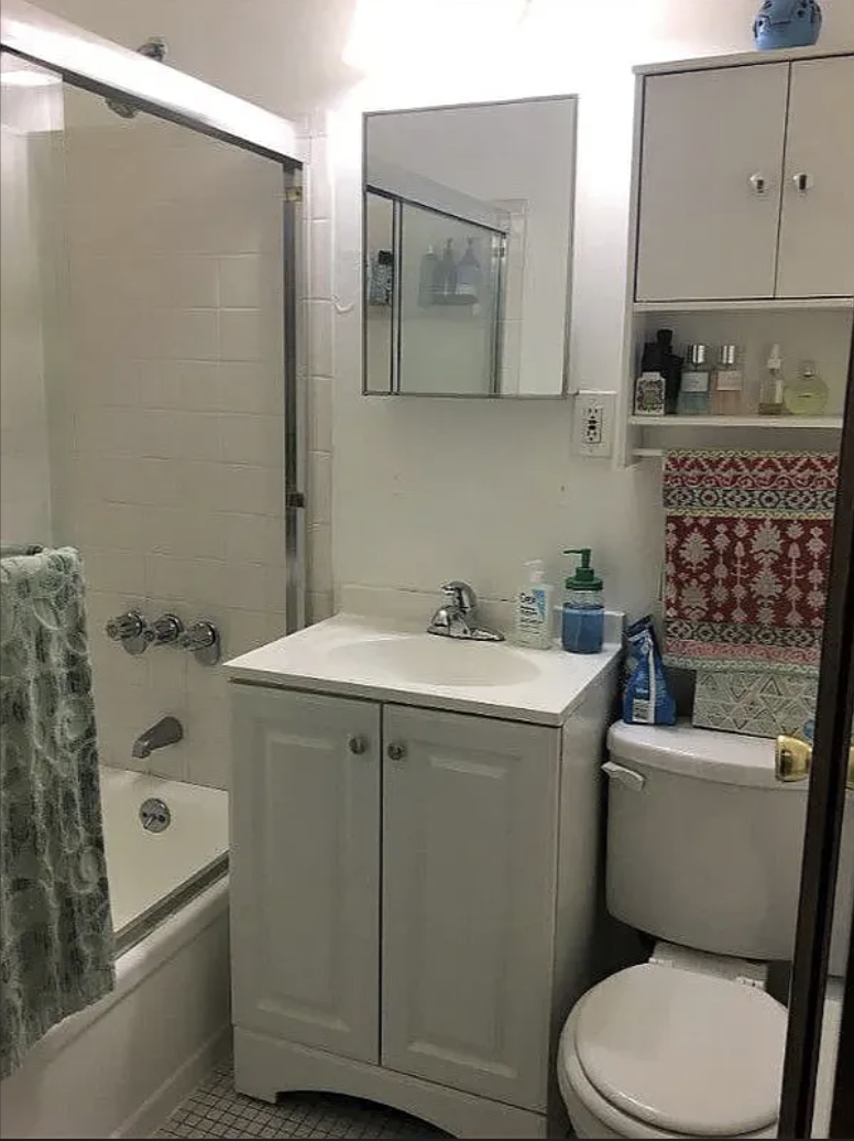 305 East 95th Street, Unit 4E Manhattan, NY 10128 - Photo 7 of 12 a bathroom with a sink toilet and shower