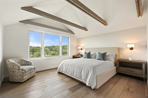 a bedroom with a bed and a couch