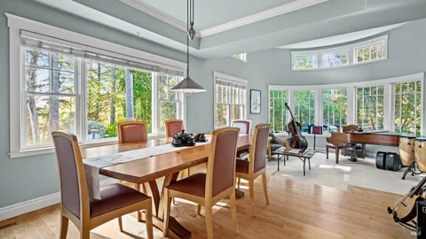 a view of a dining room with furniture window and outside view