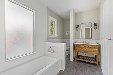 a utility room with sink dryer and washer