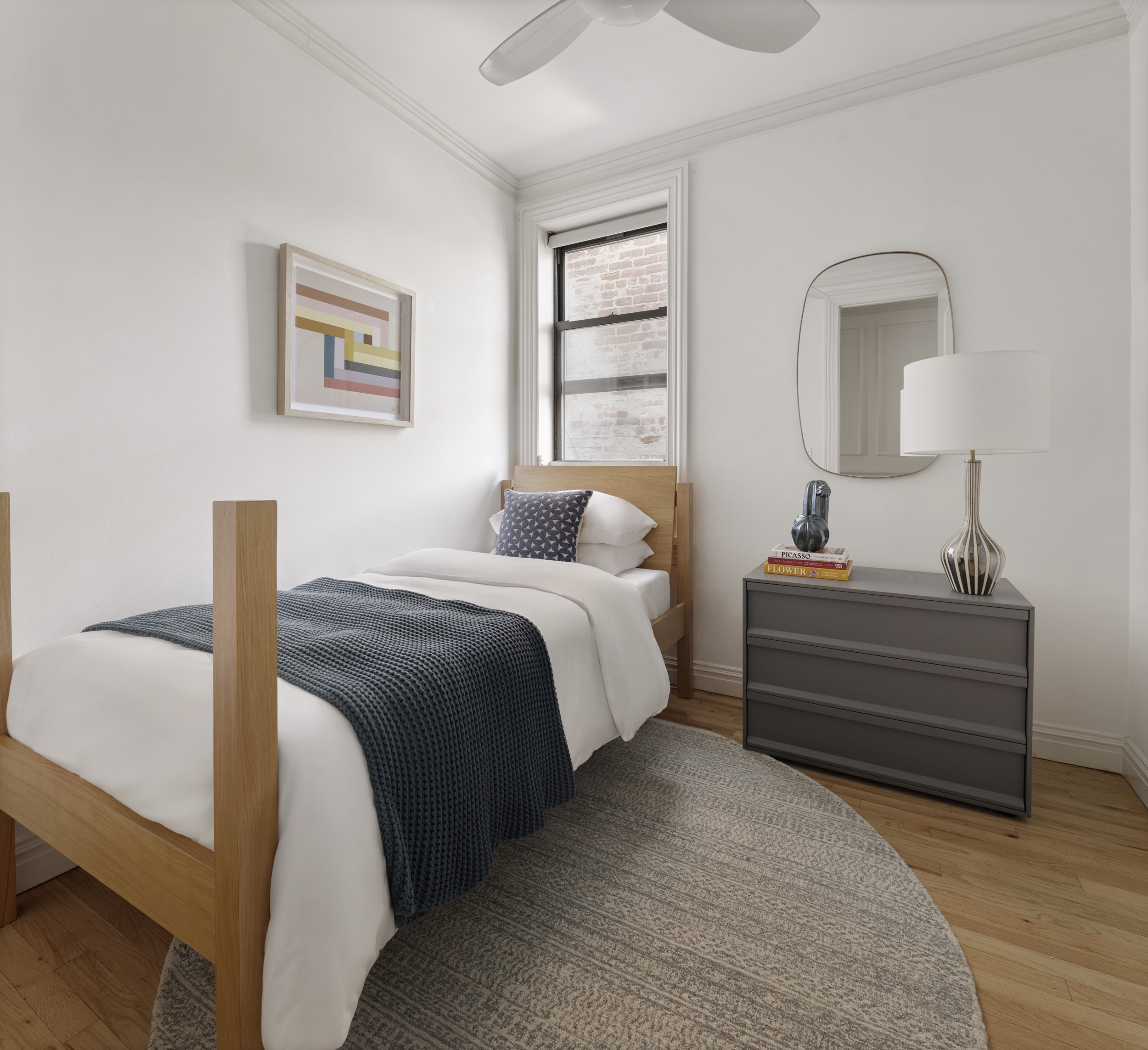 209 Clinton Street, Unit 4L Brooklyn, NY 11201 - Photo 13 of 17 a bedroom with a bed and a window