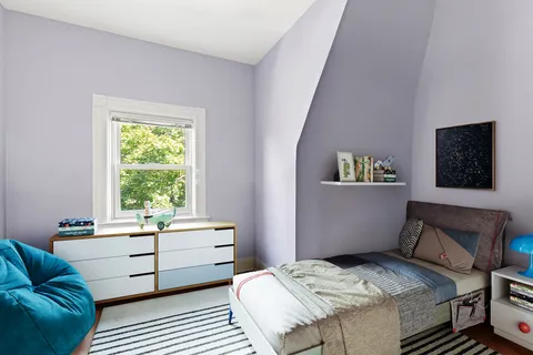 a bedroom with a bed and a couch