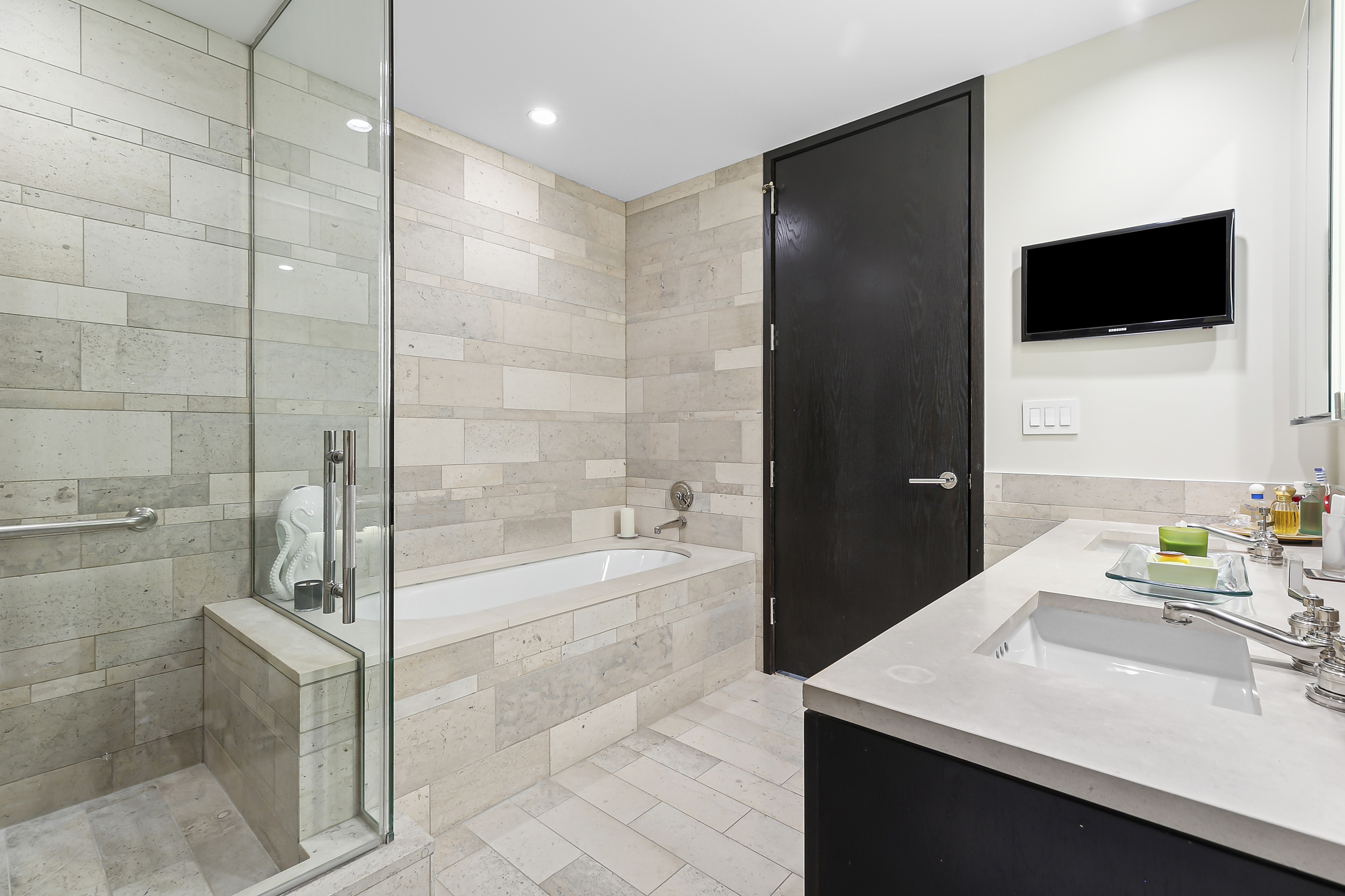 450 East 83rd Street, Unit PH1B Manhattan, NY 10028 - Photo 9 of 15 a bathroom with a sink a toilet and shower