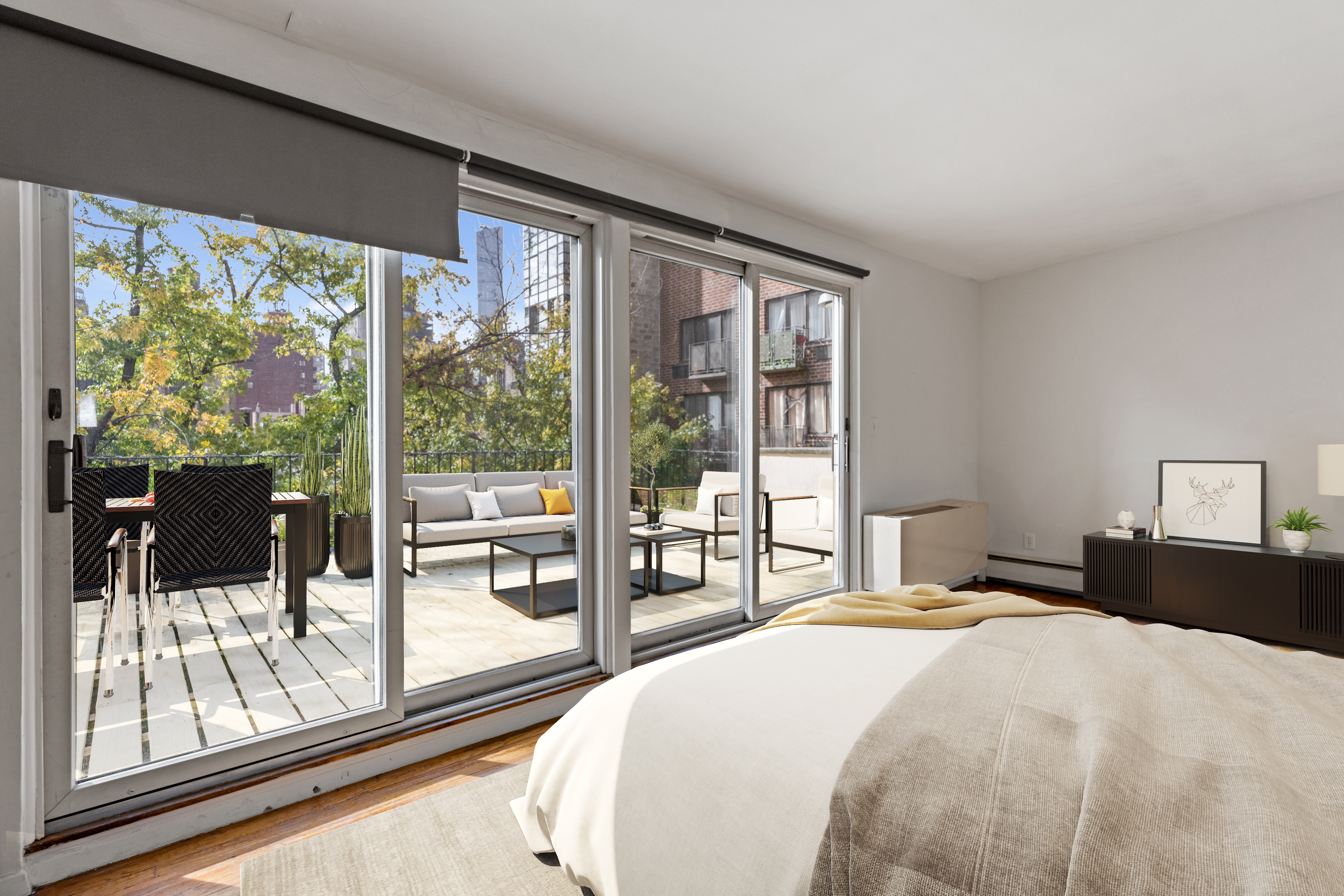 136 East 30th Street, Unit 3R Manhattan, NY 10016 - Photo 2 of 23 a bedroom with a large bed and a large window