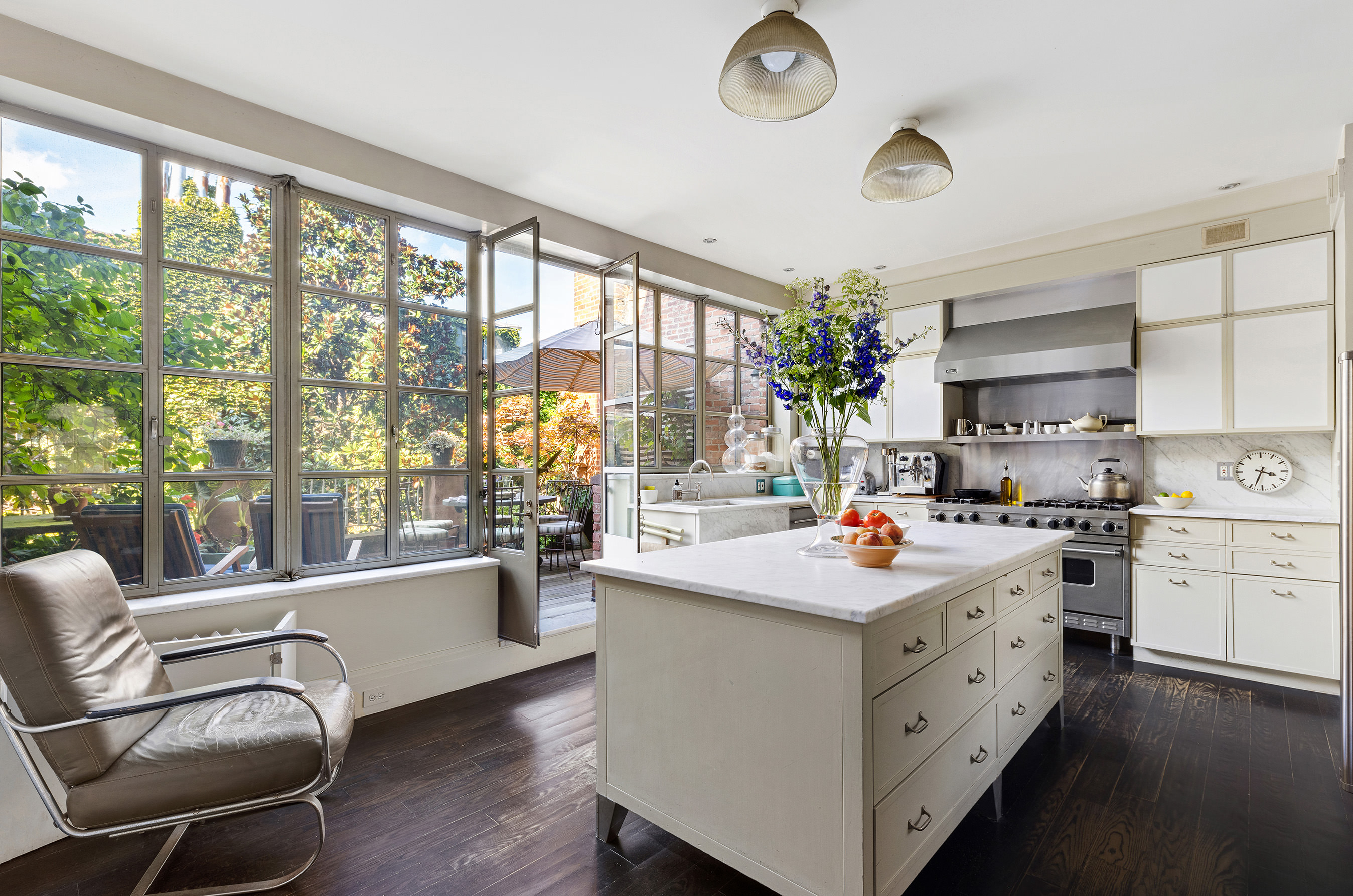 25 Perry Street Manhattan, NY 10014 - Photo 16 of 32 a kitchen with a stove a sink dishwasher and a fireplace