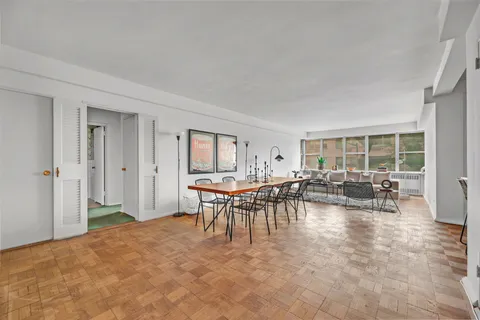 a view of a livingroom with furniture and window