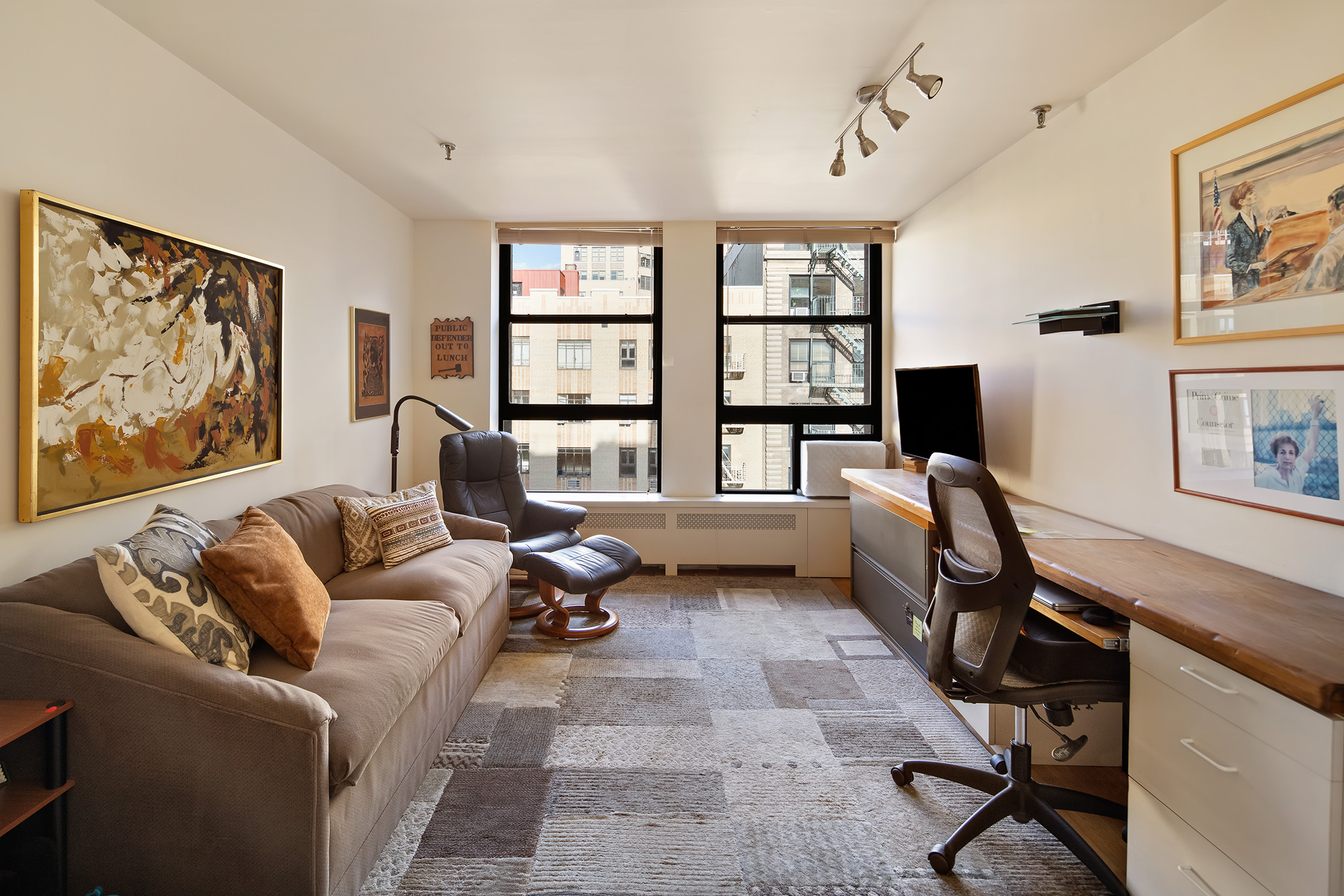 240 West 23rd Street, Unit 5A Manhattan, NY 10011 - Photo 5 of 7 a living room with furniture a rug and a window