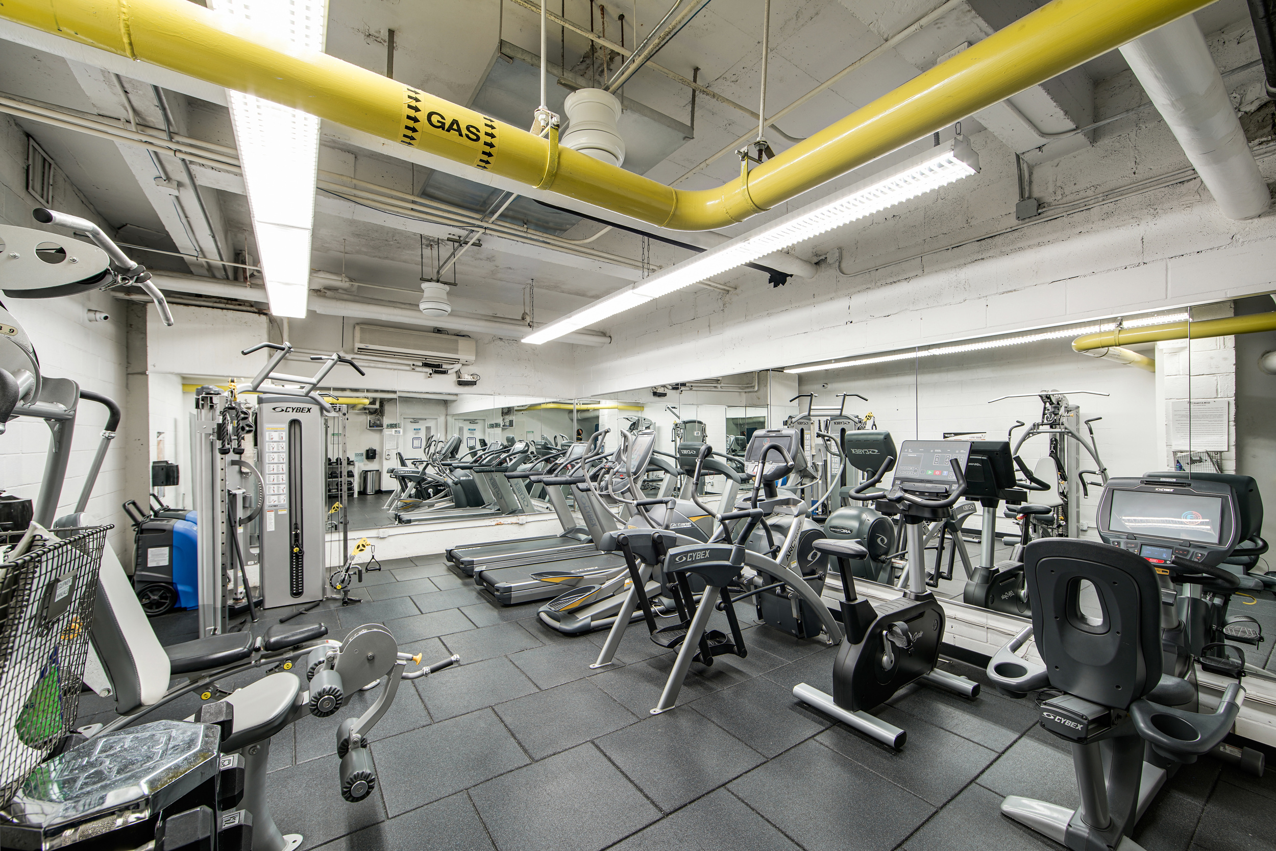 401 East 65th Street, Unit 16C Manhattan, NY 10065 - Photo 11 of 13 a view of a room with gym equipment