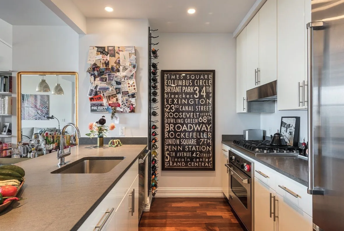1 Hanson Place, Unit 15C Brooklyn, NY 11243 - Photo 2 of 8 a kitchen with stainless steel appliances a sink a stove and a refrigerator