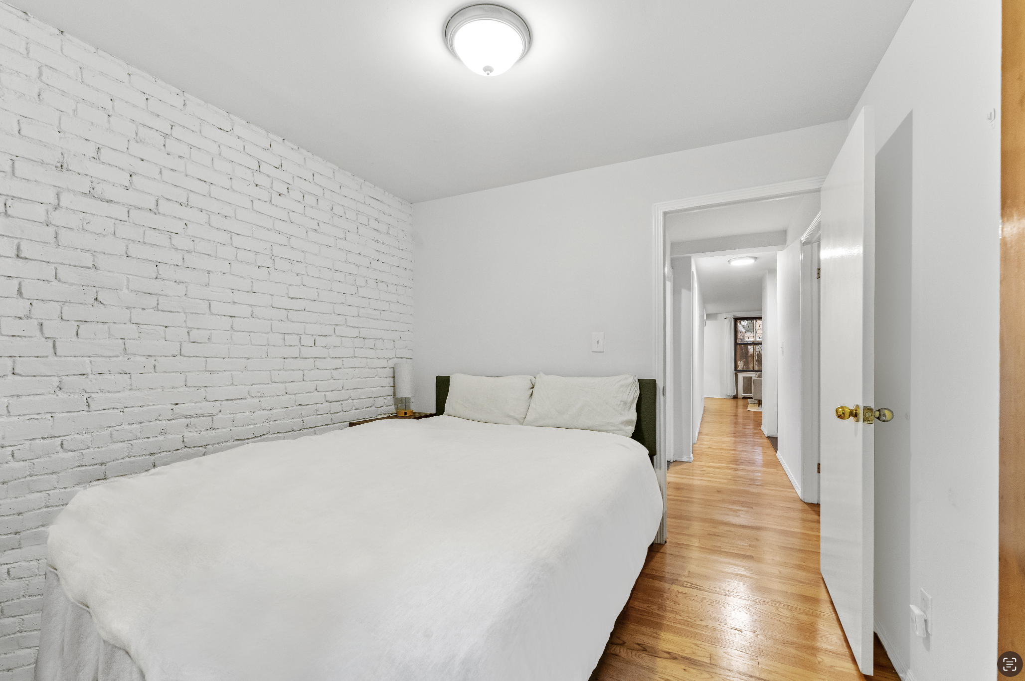 355 West 20th Street, Unit 1 Manhattan, NY 10011 - Photo 7 of 9 a large white bed in a white room