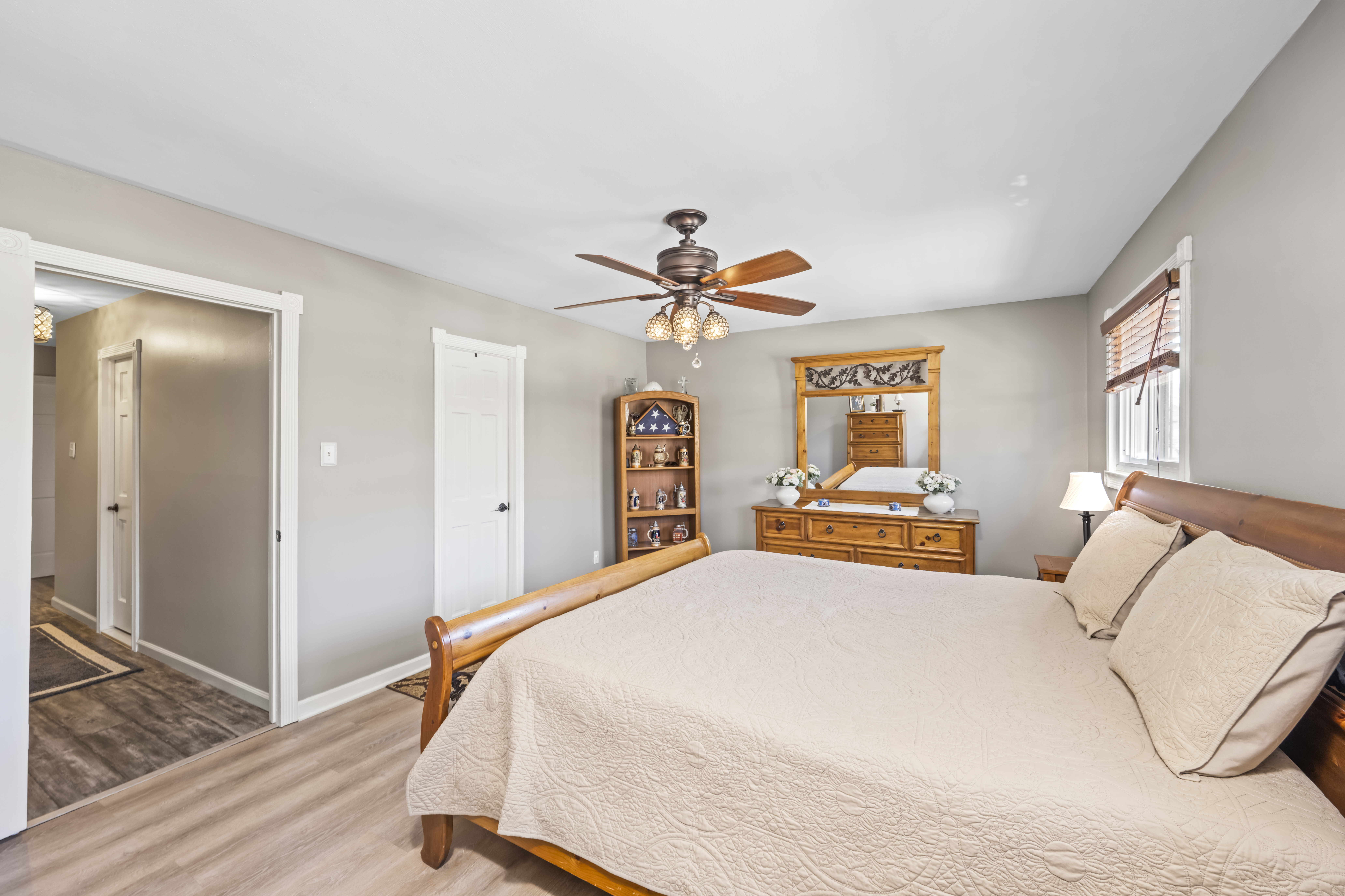 15 Hickory Circle Staten Island, NY 10312 - Photo 24 of 40 a bedroom with a bed and a chandelier