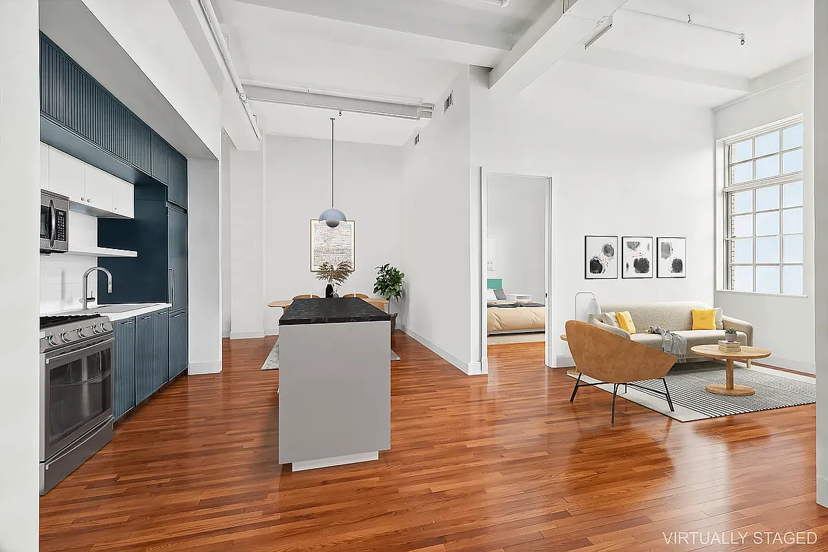 180 Bainbridge Street, Unit 401 Brooklyn, NY 11233 - Photo 3 of 23 a living room with furniture and a kitchen view
