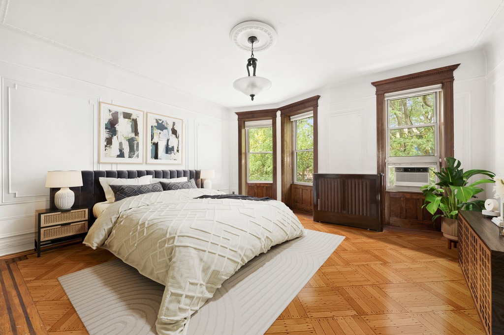 524 3rd Street Brooklyn, NY 11215 - Photo 11 of 18 a bedroom with a large bed and a window