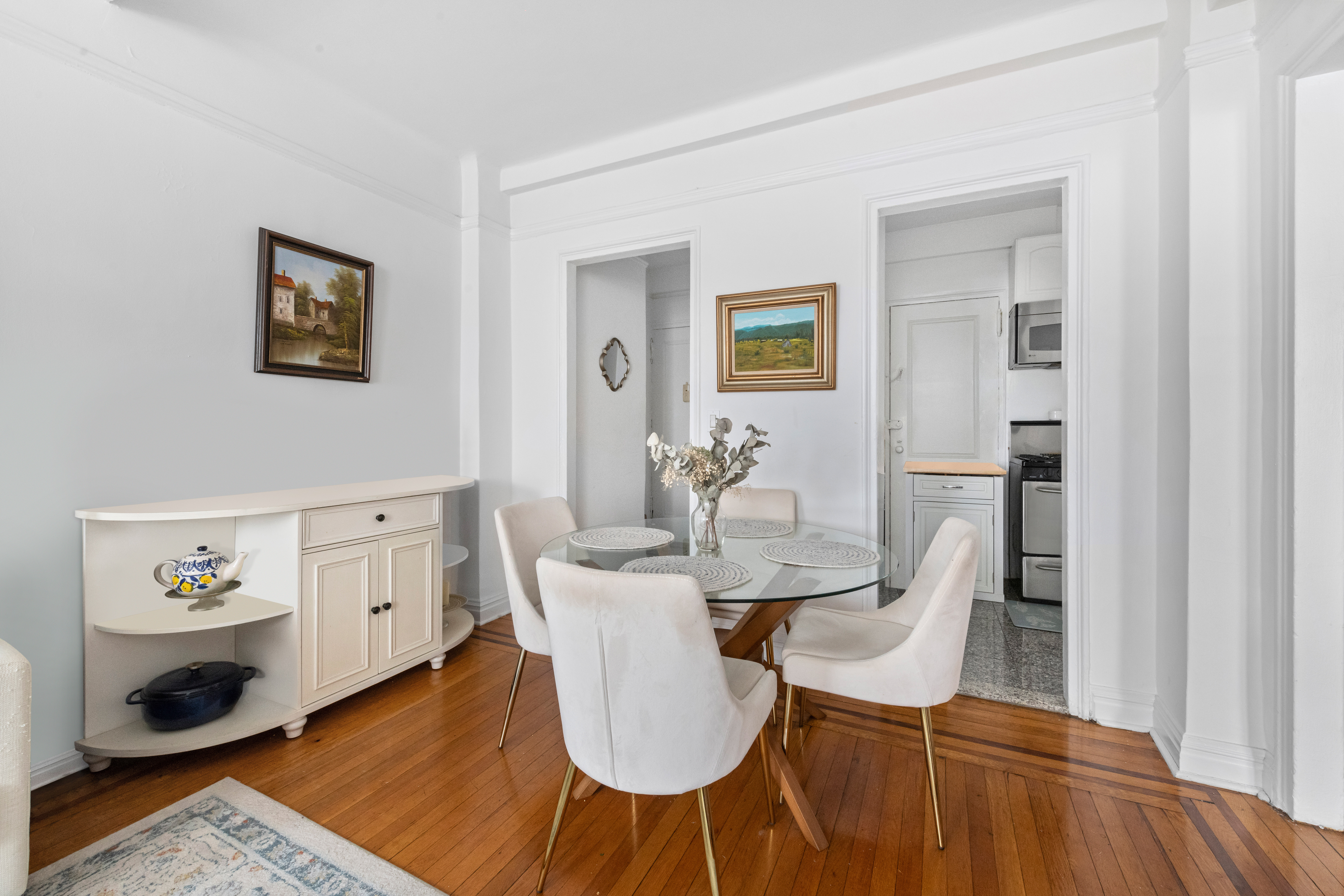 142 East 49th Street, Unit 7B Manhattan, NY 10017 - Photo 2 of 11 a view of a dining room with furniture and wooden floor