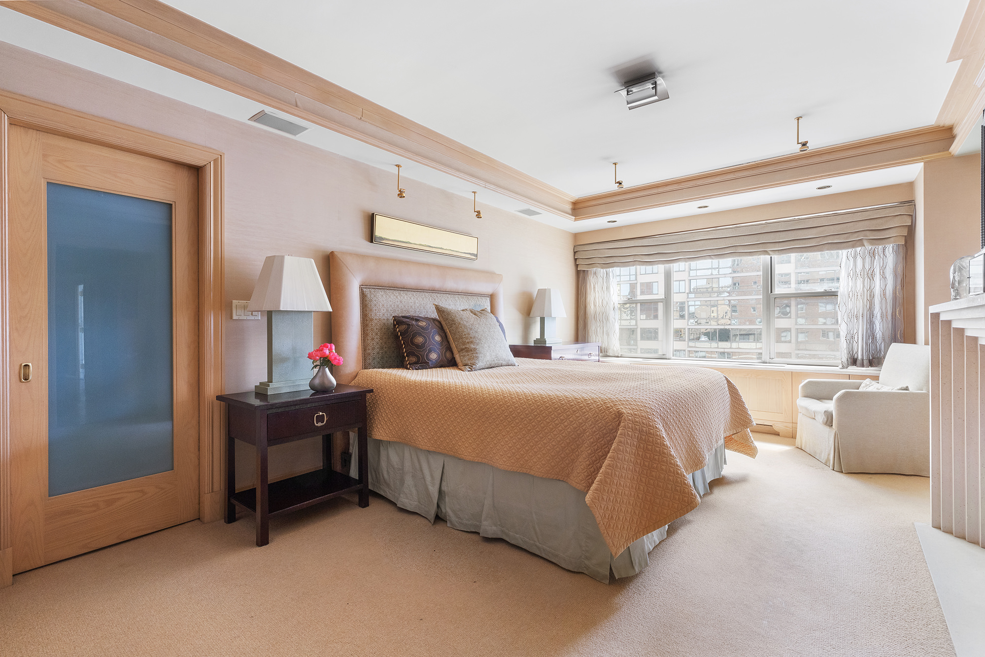 360 East 72nd Street, Unit C1801 Manhattan, NY 10021 - Photo 10 of 20 a bedroom with a bed and a large window