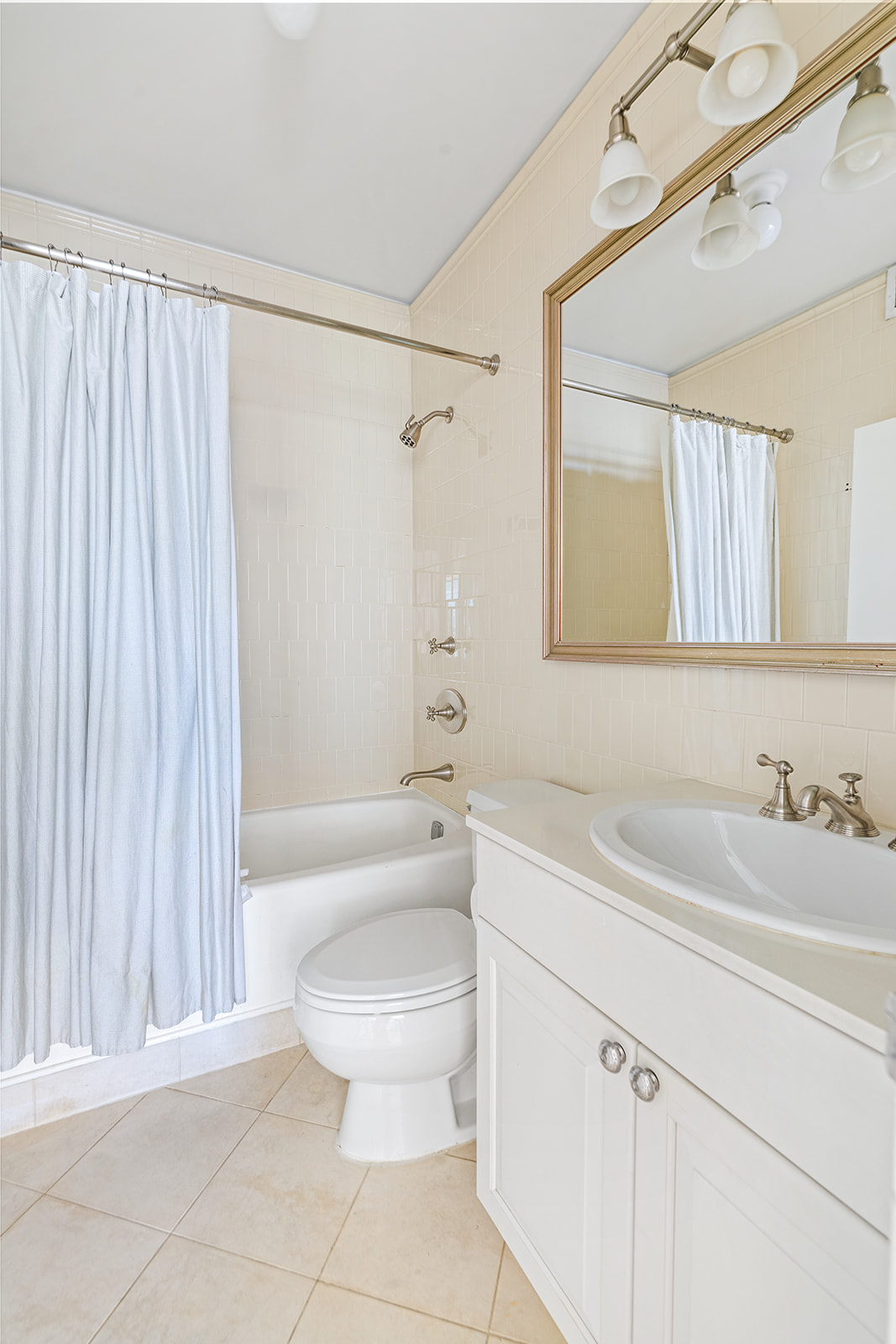 167 Perry Street, Unit 5D Manhattan, NY 10014 - Photo 7 of 18 a bathroom with a sink a toilet and shower