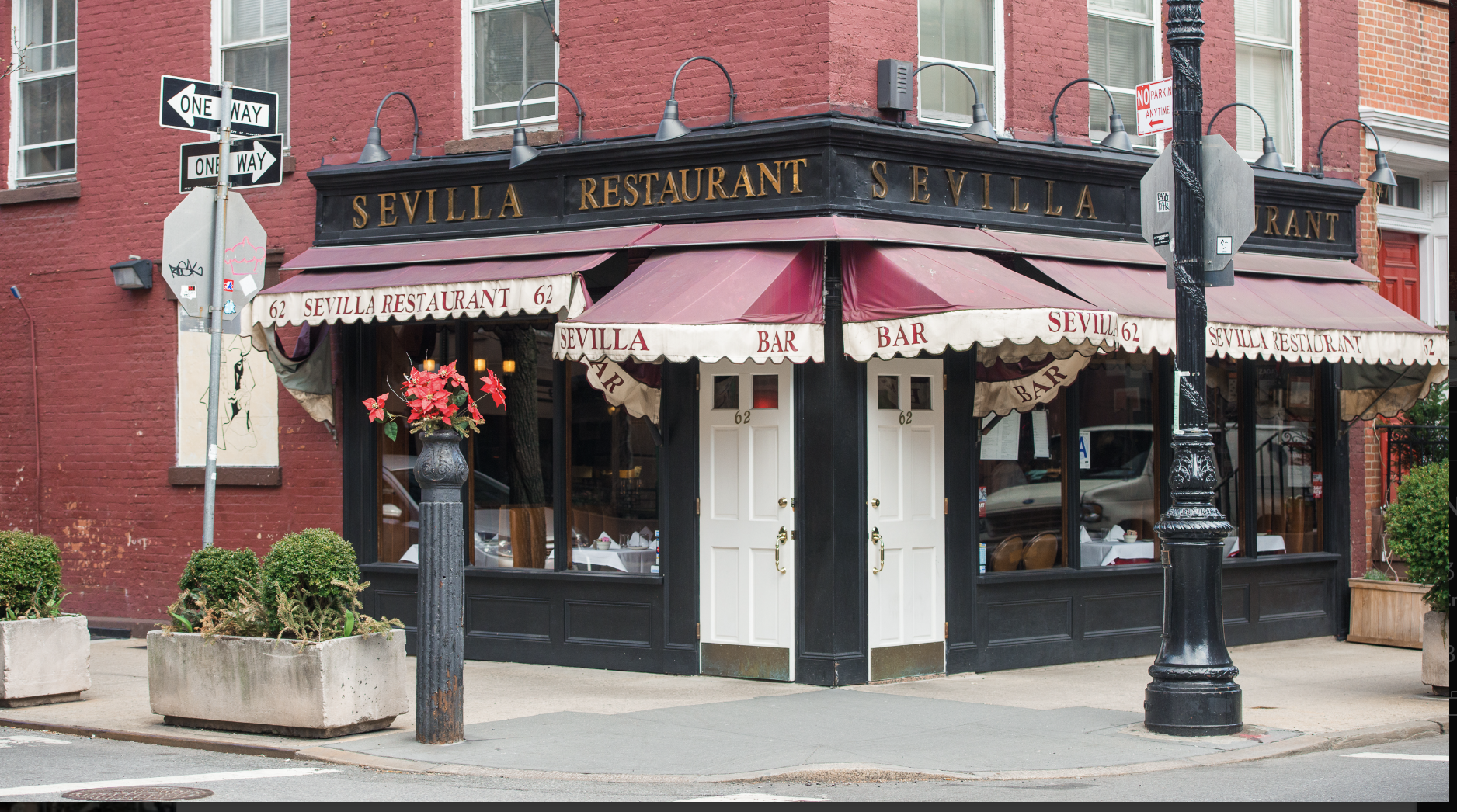 15 Charles Street, Unit 6G Manhattan, NY 10014 - Photo 10 of 14 a view of a cafe with a couple of people sitting under an umbrella
