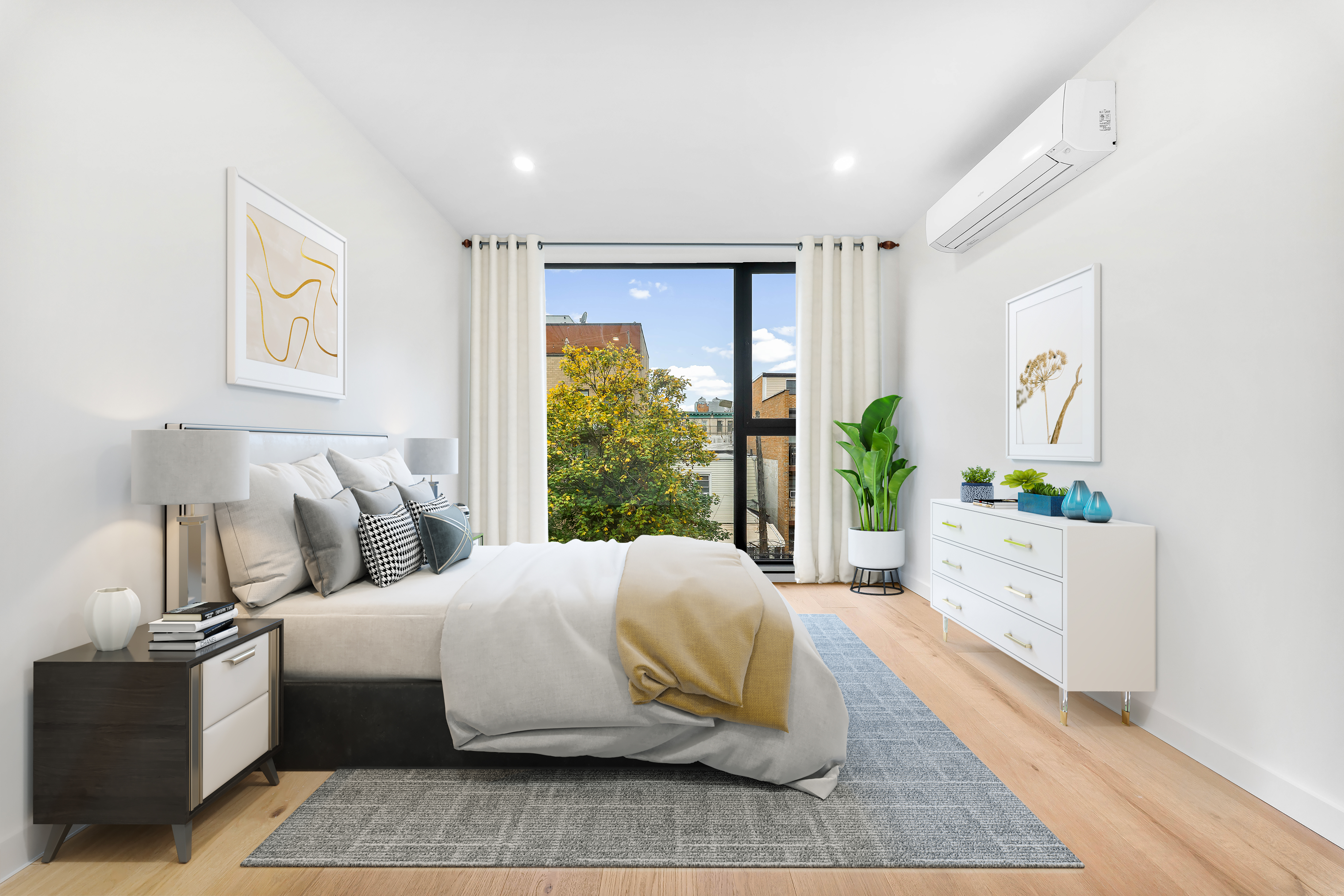 30-24 32nd Street, Unit 3A Queens, NY 11102 - Photo 10 of 18 a bedroom with a large bed and a window