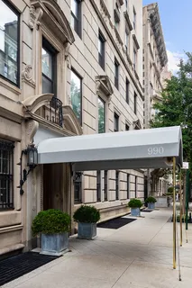 a view of a tall building next to a road