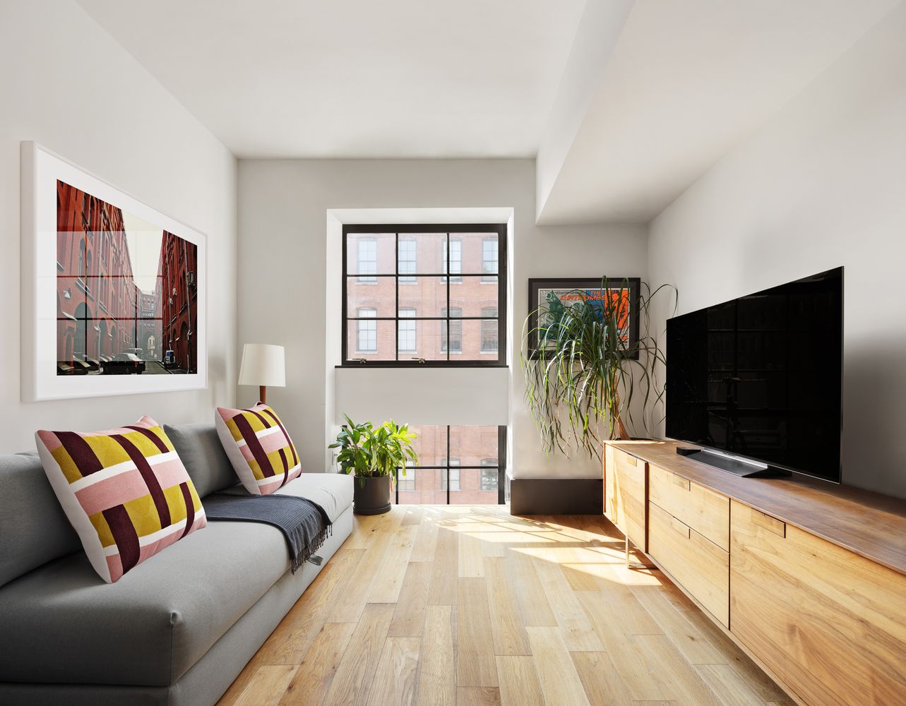 a living room with a flat screen tv and a couch