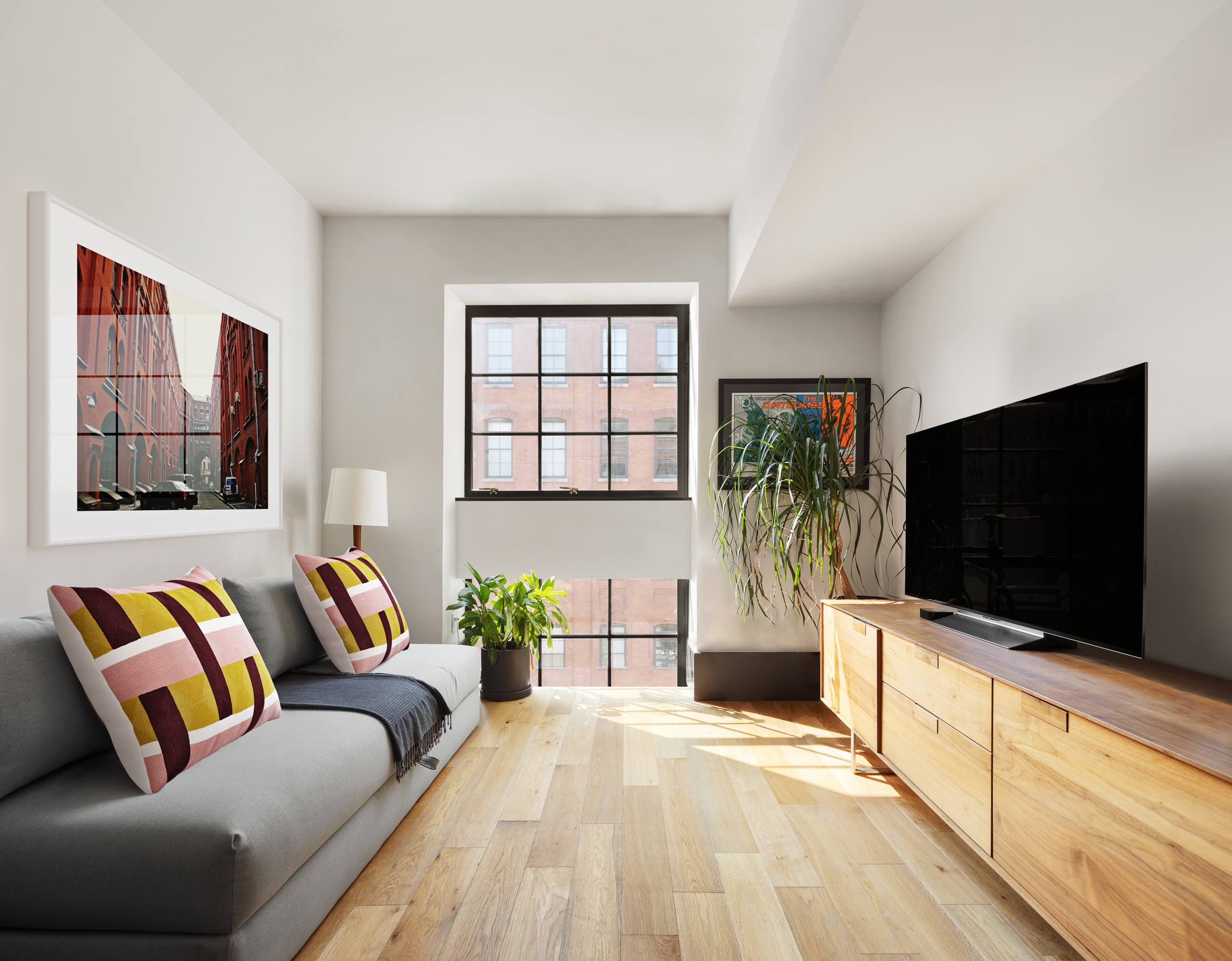 51 Jay Street, Unit 5D Brooklyn, NY 11201 - Photo 8 of 13 a living room with a flat screen tv and a couch