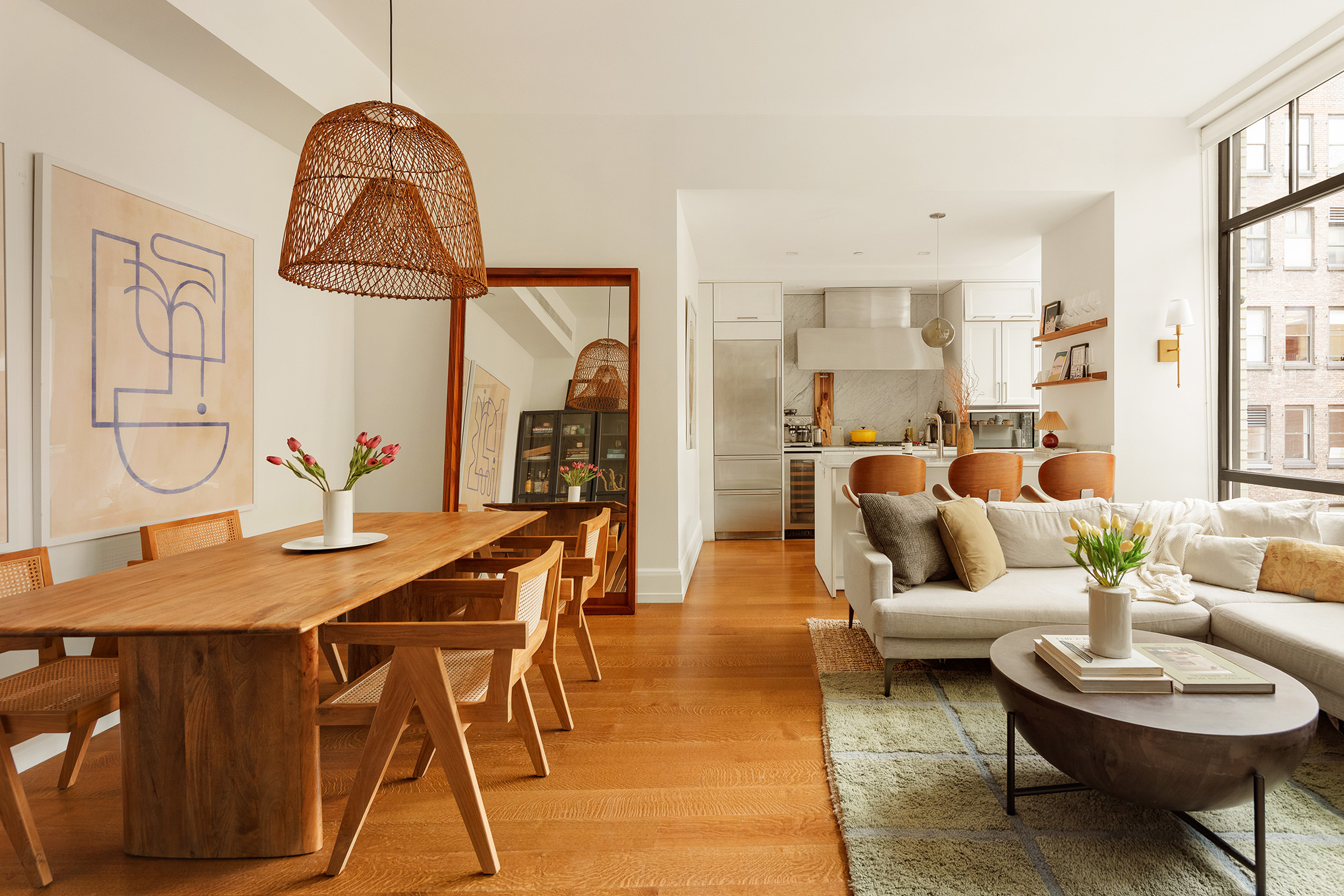 10 Madison Square West, Unit 9G Manhattan, NY 10010 - Photo 2 of 13 a living room with furniture a rug and a chandelier