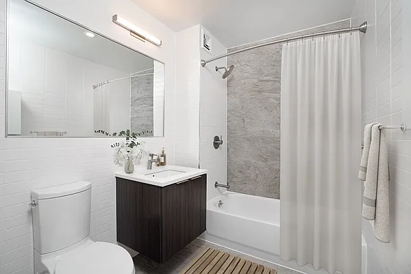 275 Park Avenue, Unit 2HH Brooklyn, NY 11205 - Photo 4 of 11 a bathroom with a sink toilet and shower