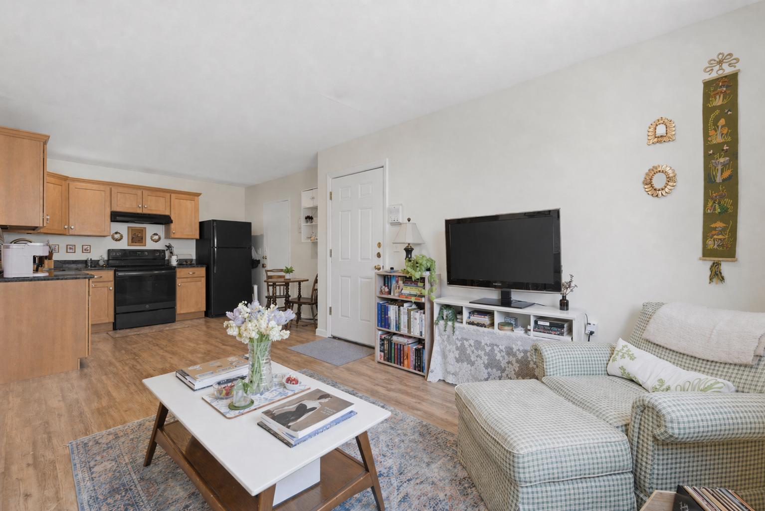 197 Calumet Street, Unit 10 Boston, MA 02120 - Photo 2 of 10 a living room with furniture and a flat screen tv