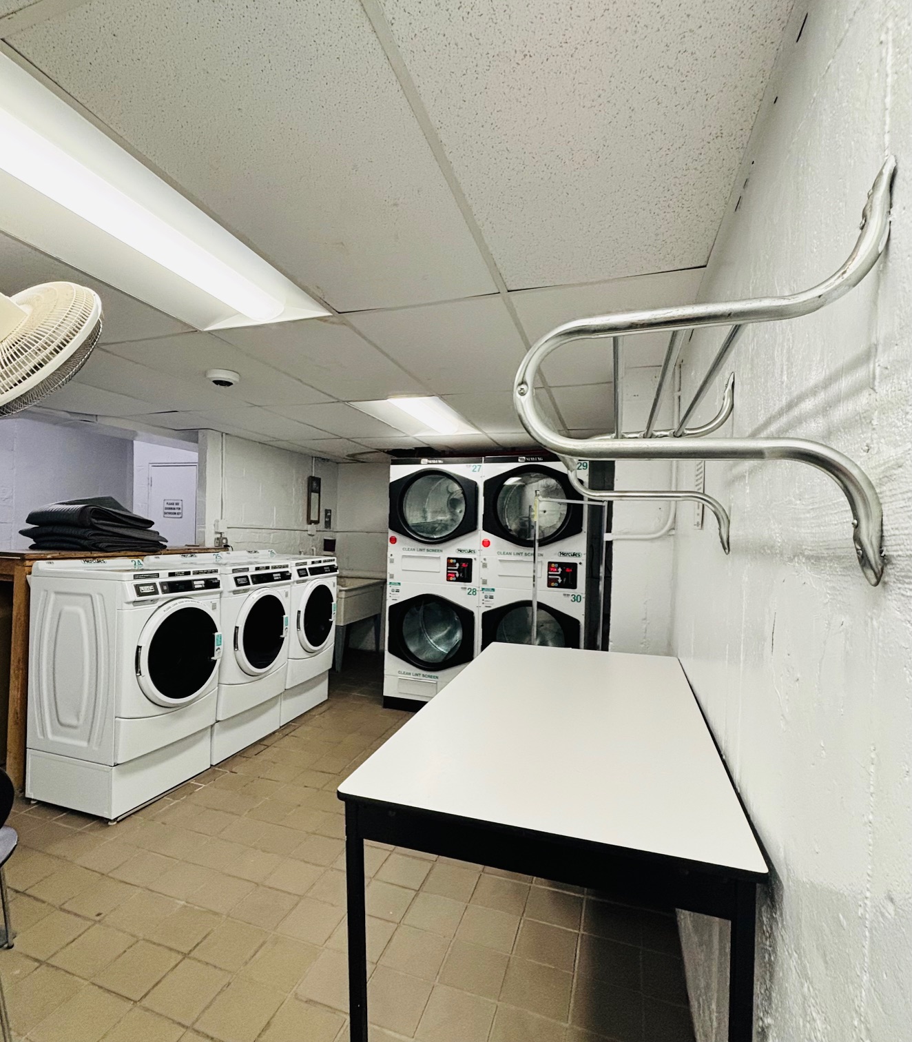 3850 Hudson Manor Terrace, Unit 1EE/2EE Bronx, NY 10463 - Photo 23 of 27 a utility room with dryer and washer