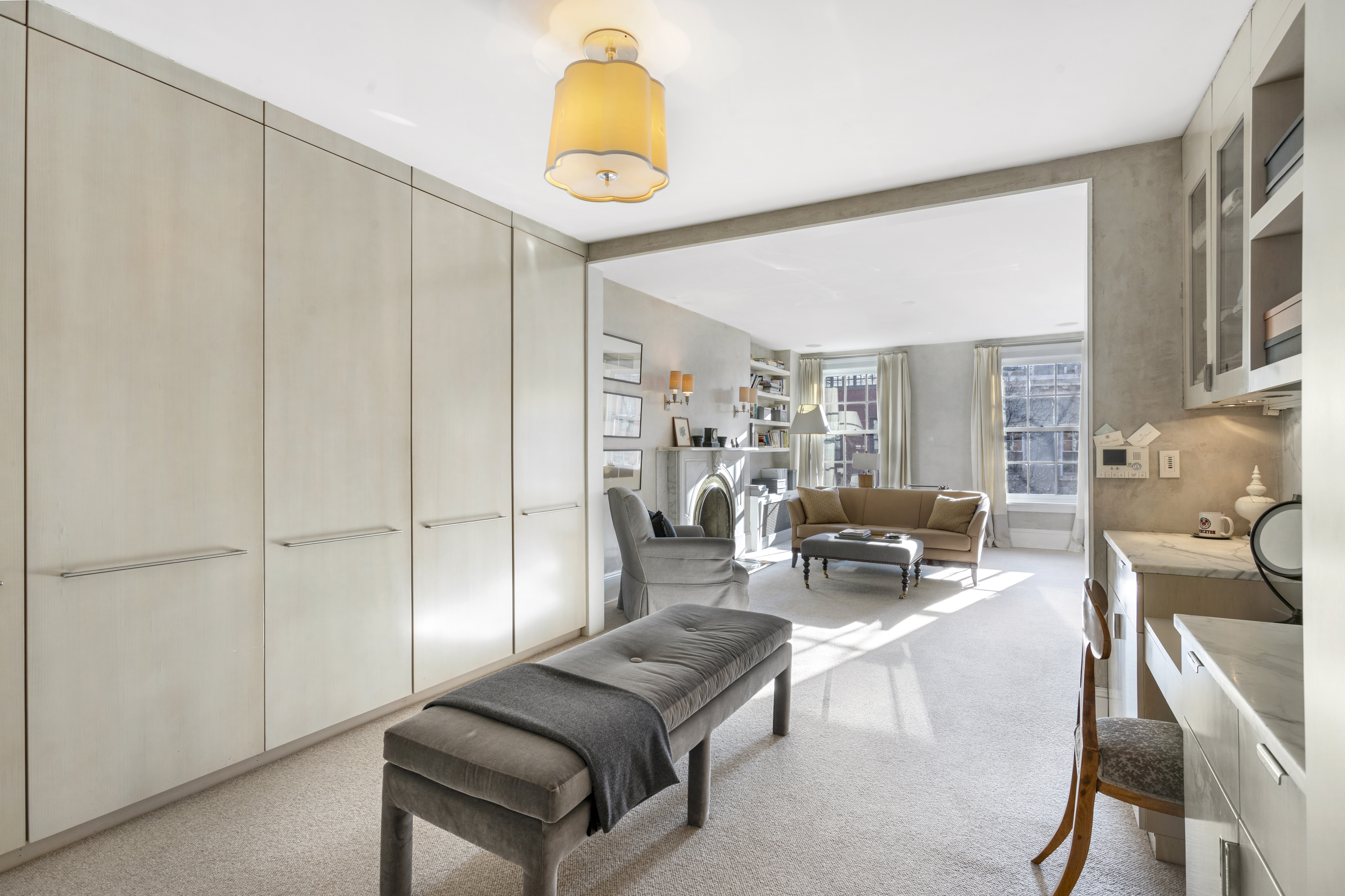 75 Washington Place, Unit TRIPLEX Manhattan, NY 10011 - Photo 5 of 14 a living room with furniture and a chandelier