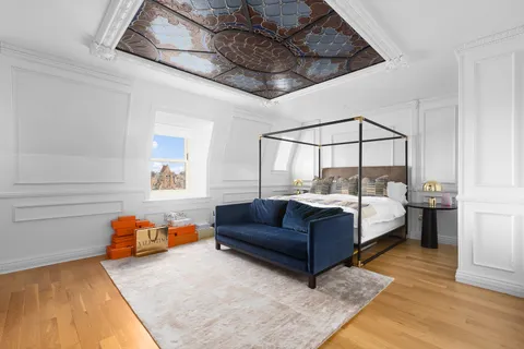 a bedroom with furniture and a couch